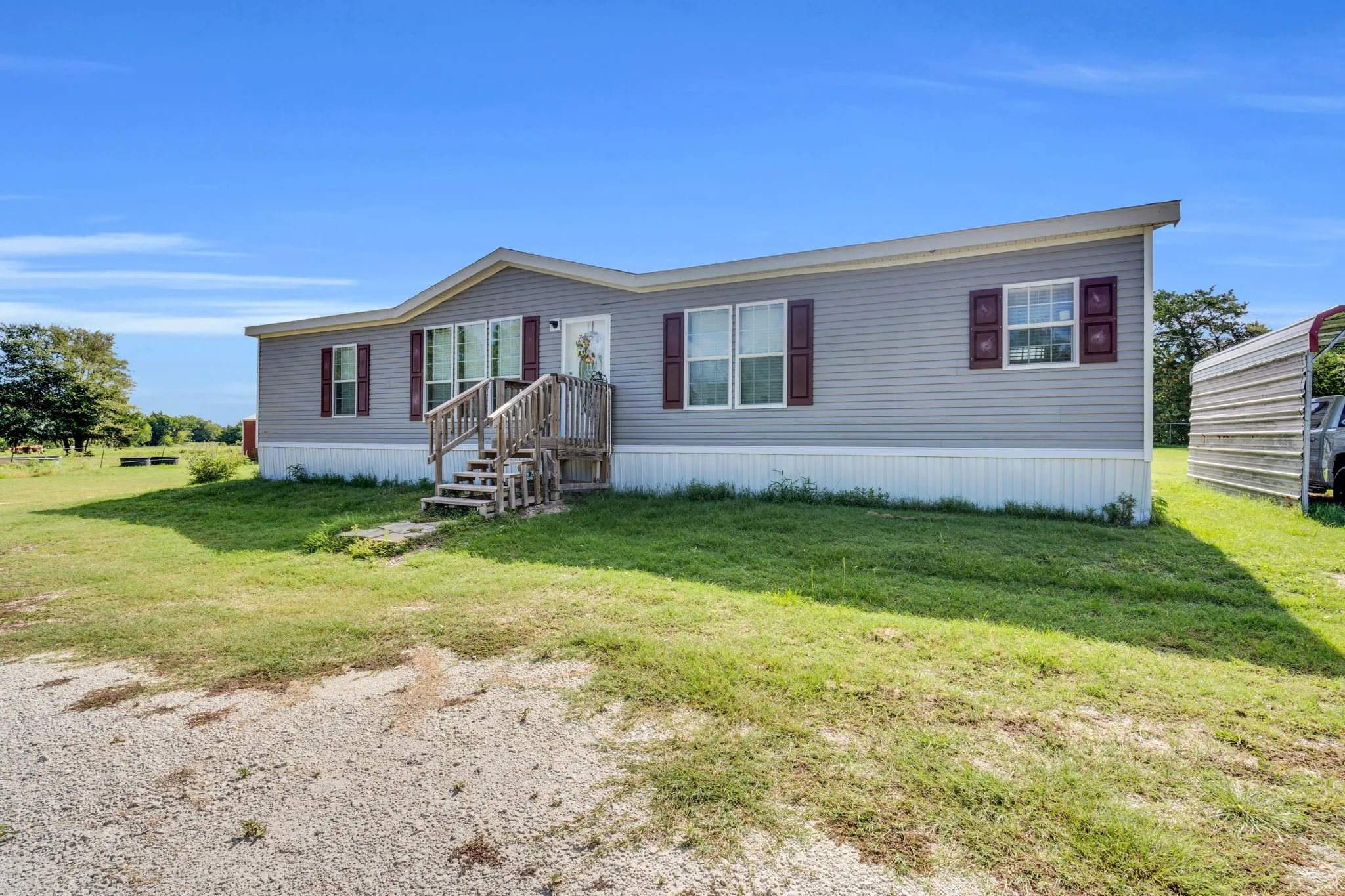 Front of home with a detached carport