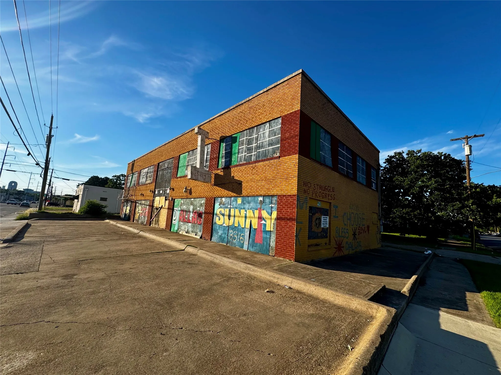 Two-story commercial building featuring brick exterior construction and multiple window openings