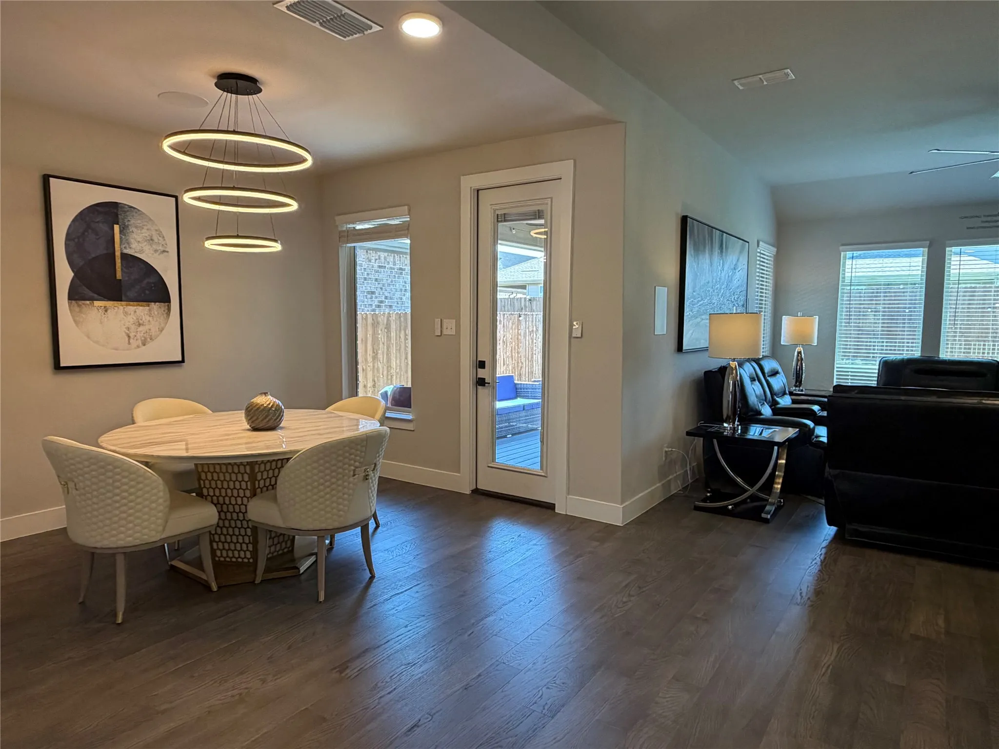 Adjacent to the Kitchen, the Oversized Breakfast Area with View of Outdoor Living. Unique Modern Light Fixtures Throughout. Engineered Wood or Tile Throughout the First Floor.