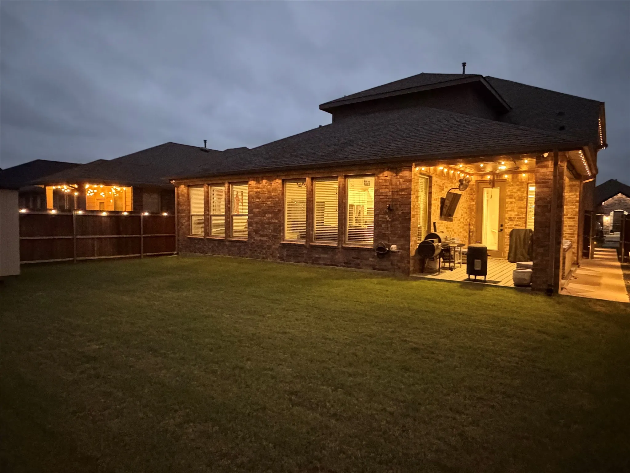 Comprehensive Lighting System that Illuminates the Covered Patio, Extended Deck, Fence and Entire Home Exterior Allowing Exciting Outdoor Entertainment.