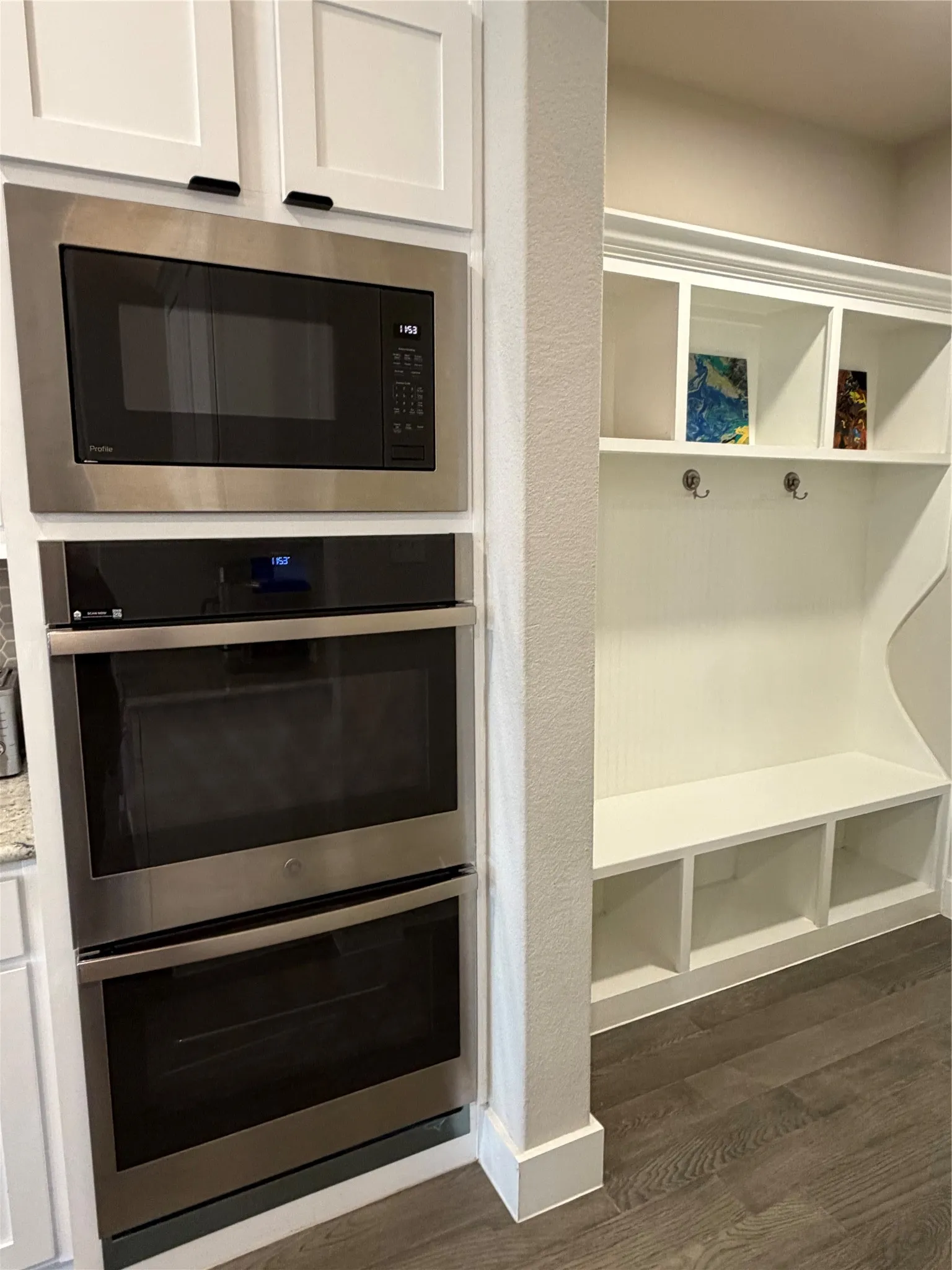 Double Ovens, Microwave and Mud Bench by Garage