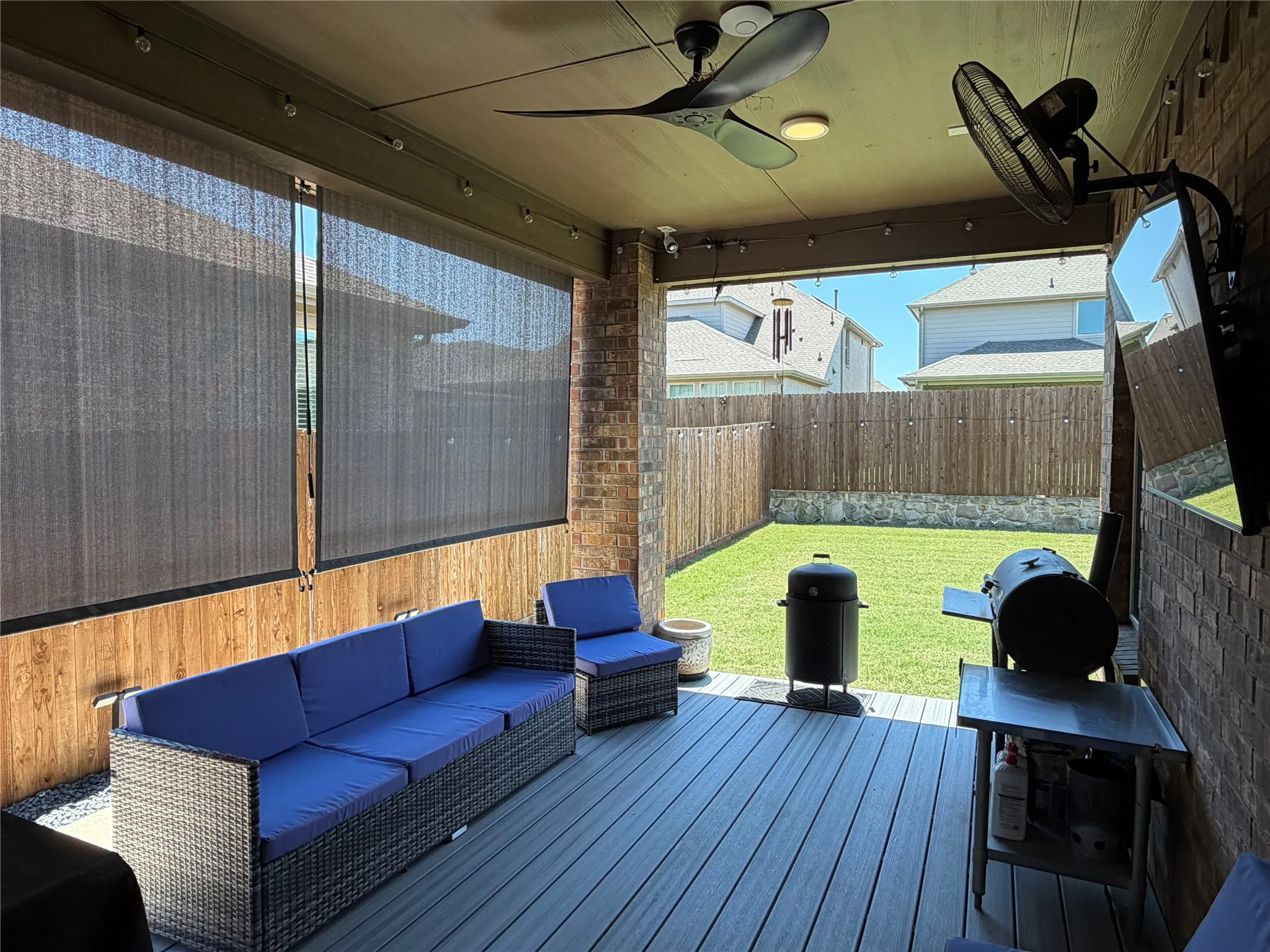 Covered Patio has UV Roller Blinds / Solar Shades to provide Customizable Privacy and Protection from the Sun While Maintaining Air Flow