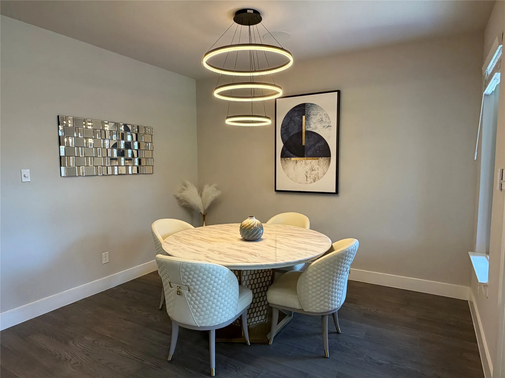 Another Angle of Breakfast Area. Unique Modern Light Fixtures Throughout