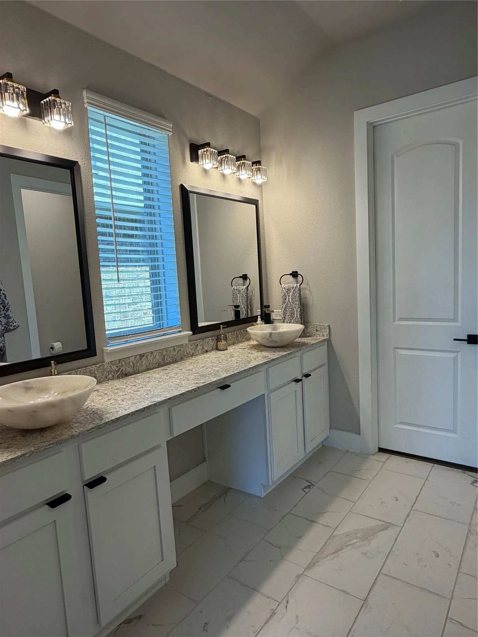 Twin Vanities and Sit-Down Makeup Area