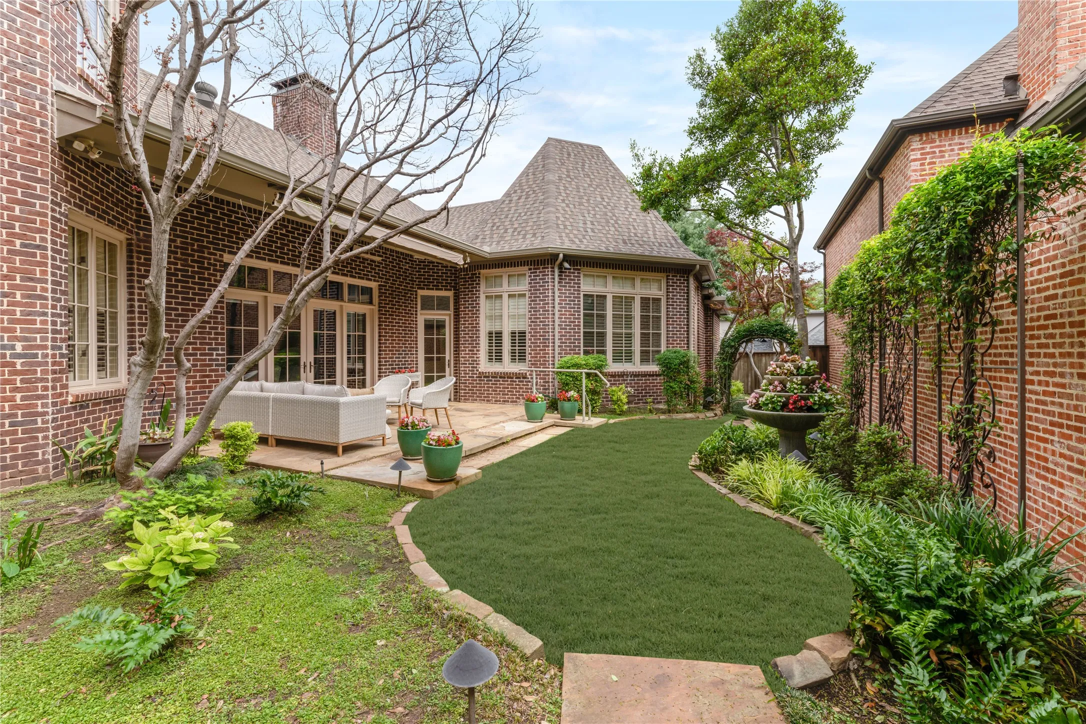 Sizable lush  back lawn viewed from Primary and living areas.