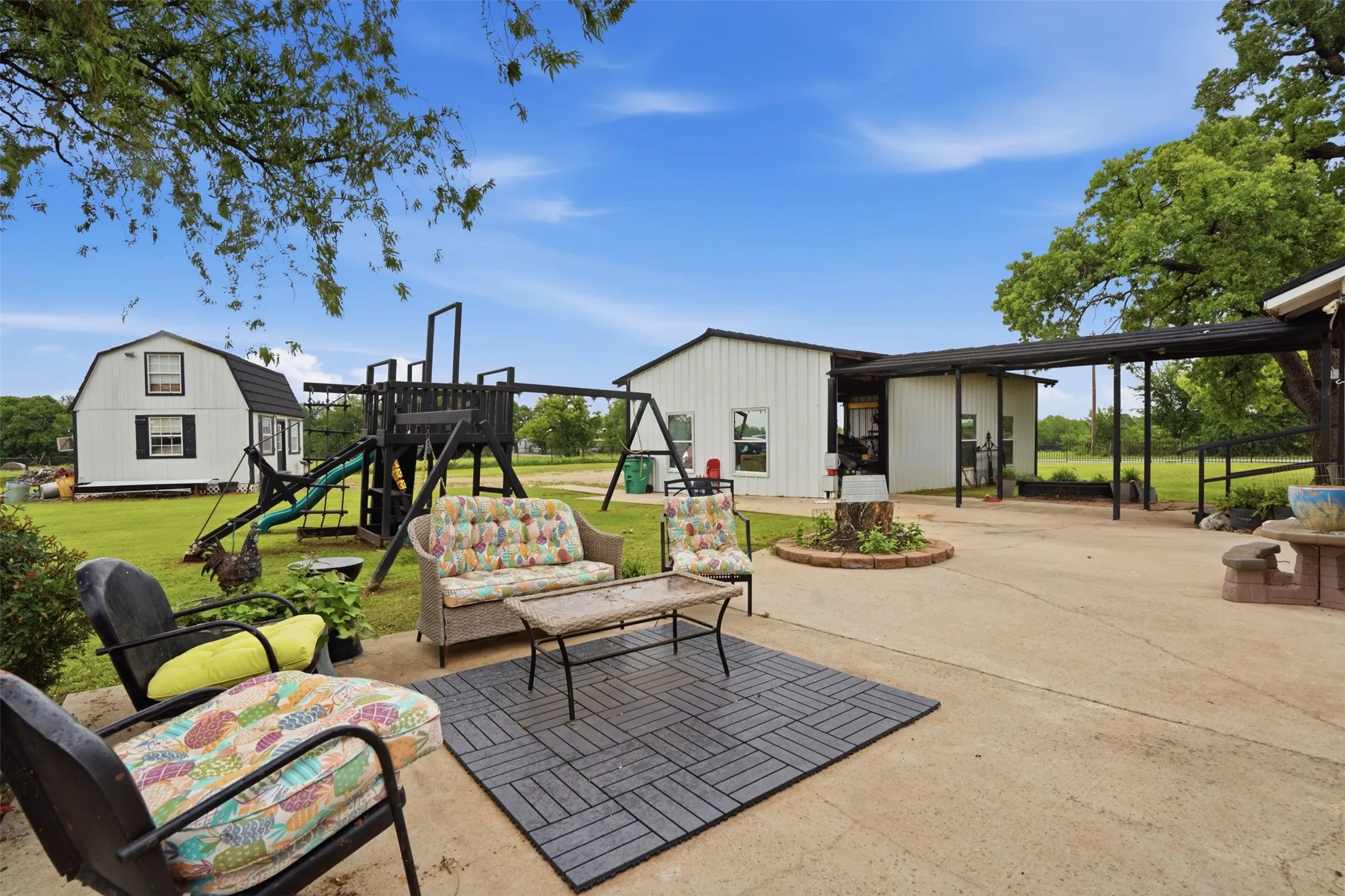 Expansive concrete patio with a covered outdoor area