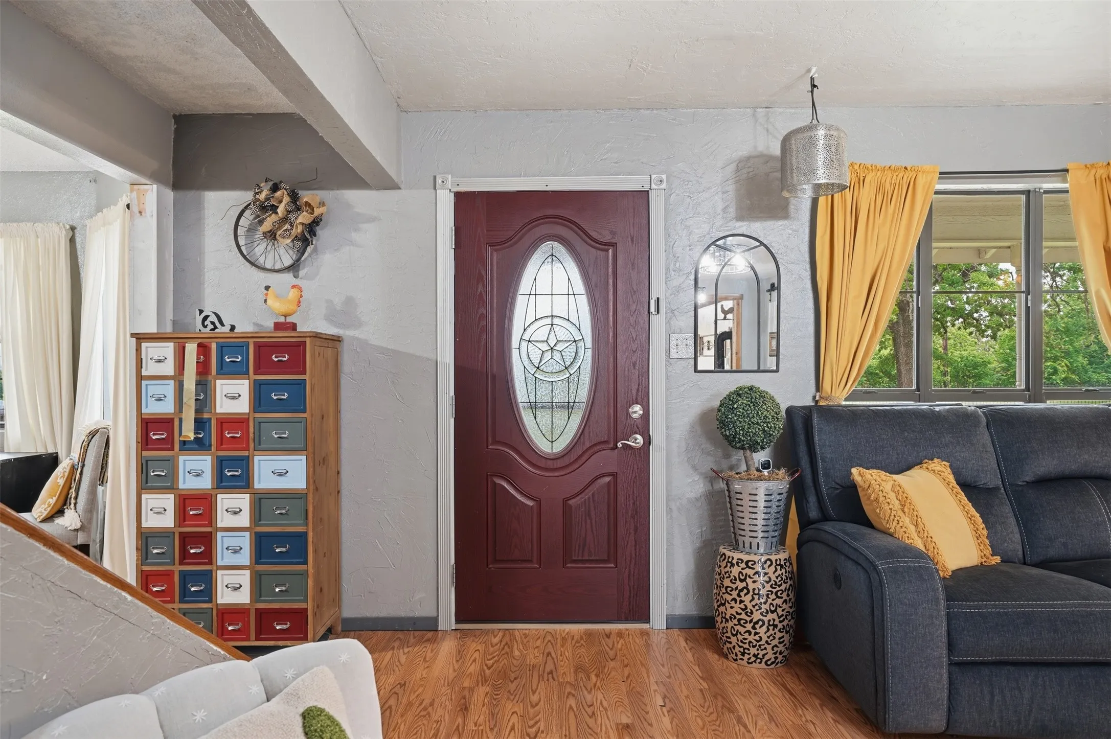 Entry door with an oval glass insert and star detail
