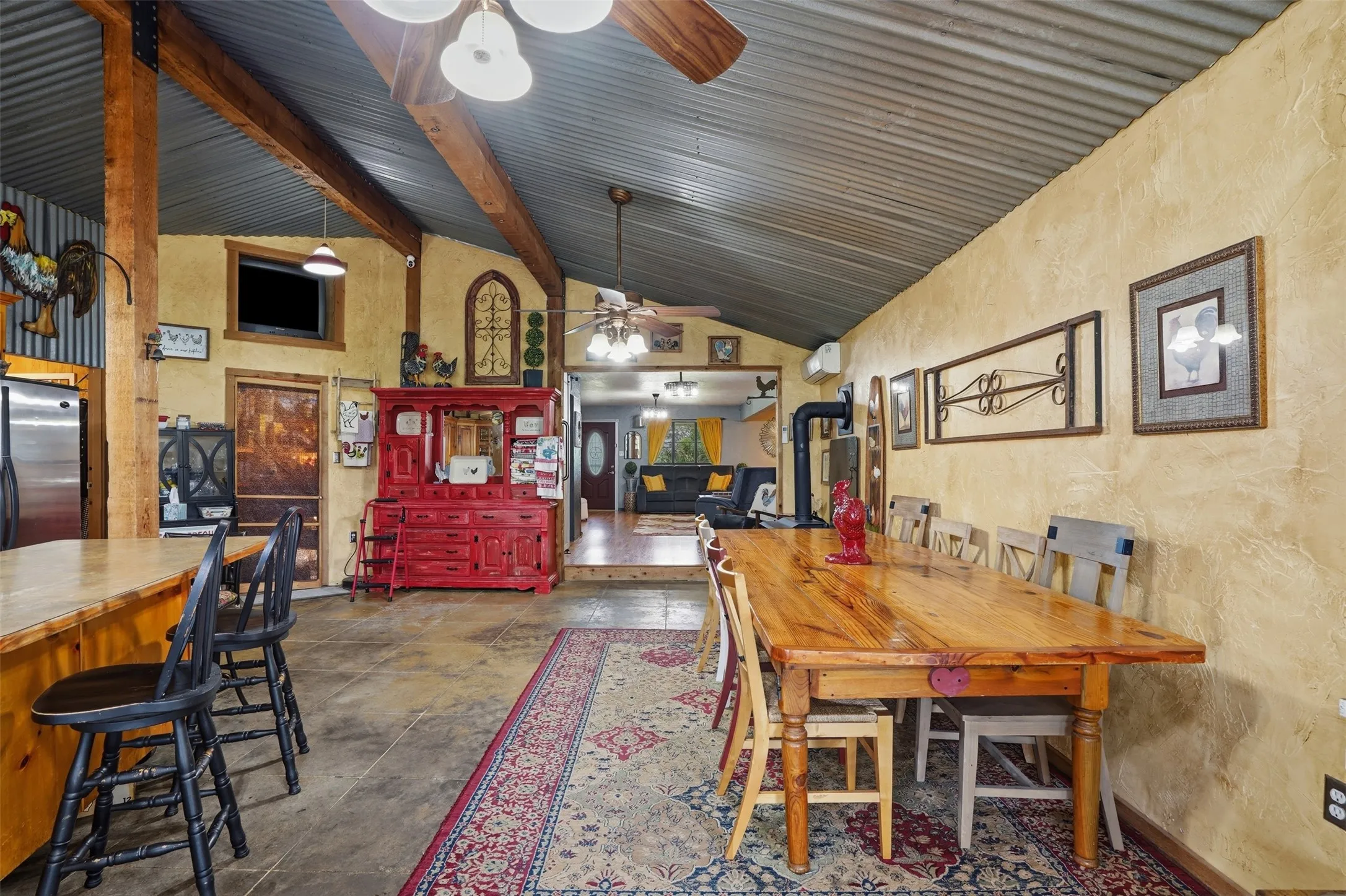 Vaulted ceiling with exposed wood beams and corrugated metal finish