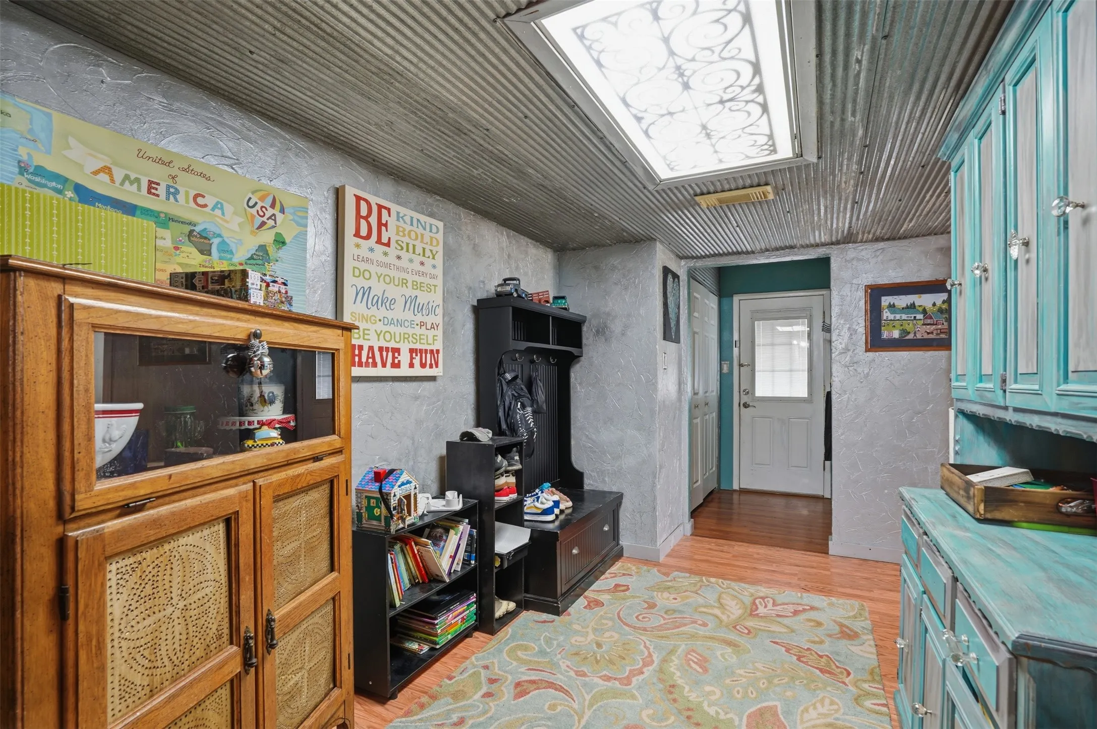Corrugated metal ceiling with a decorative fluorescent light fixture