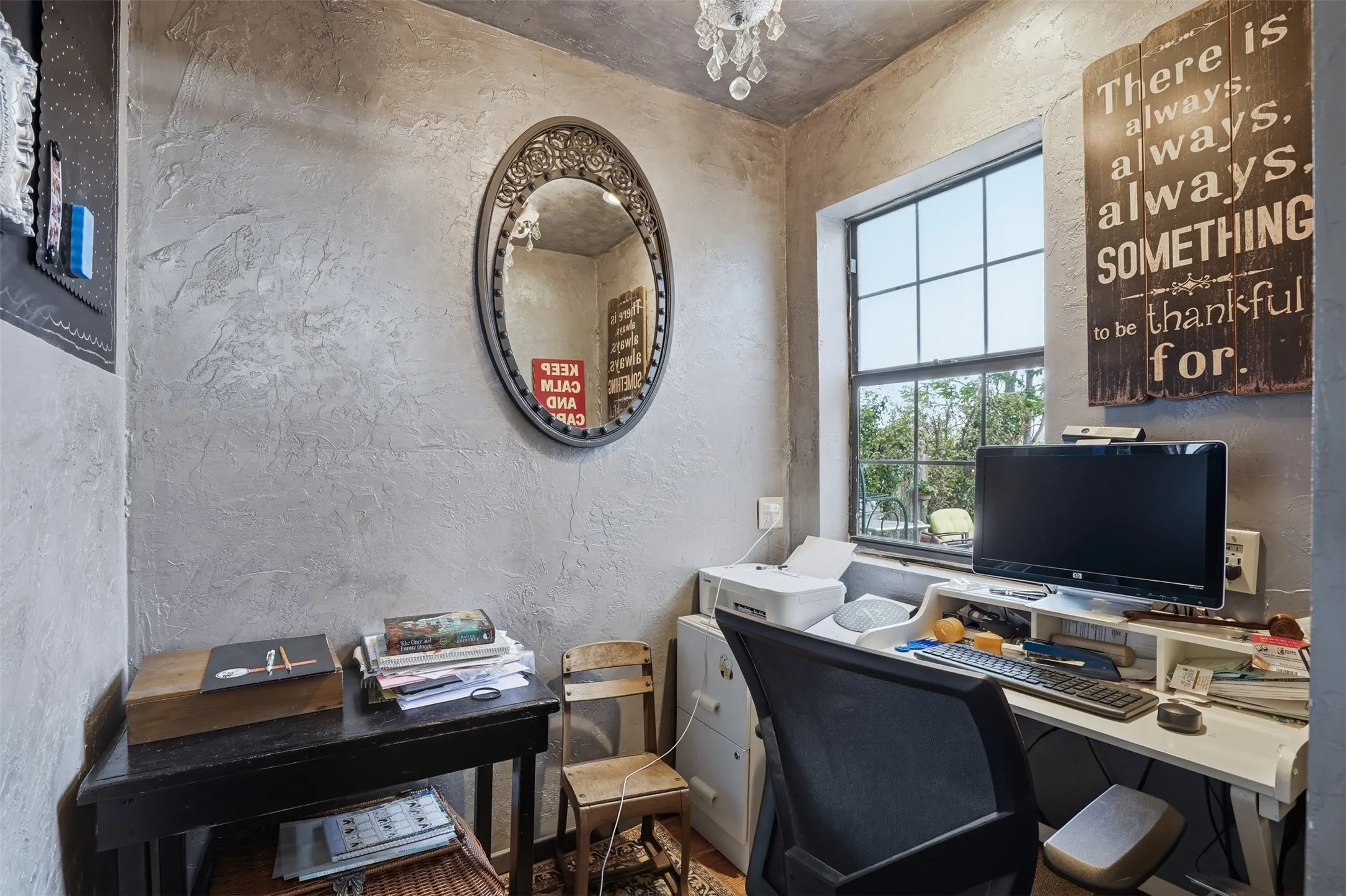 Windowed room featuring textured walls and a multi-paned window