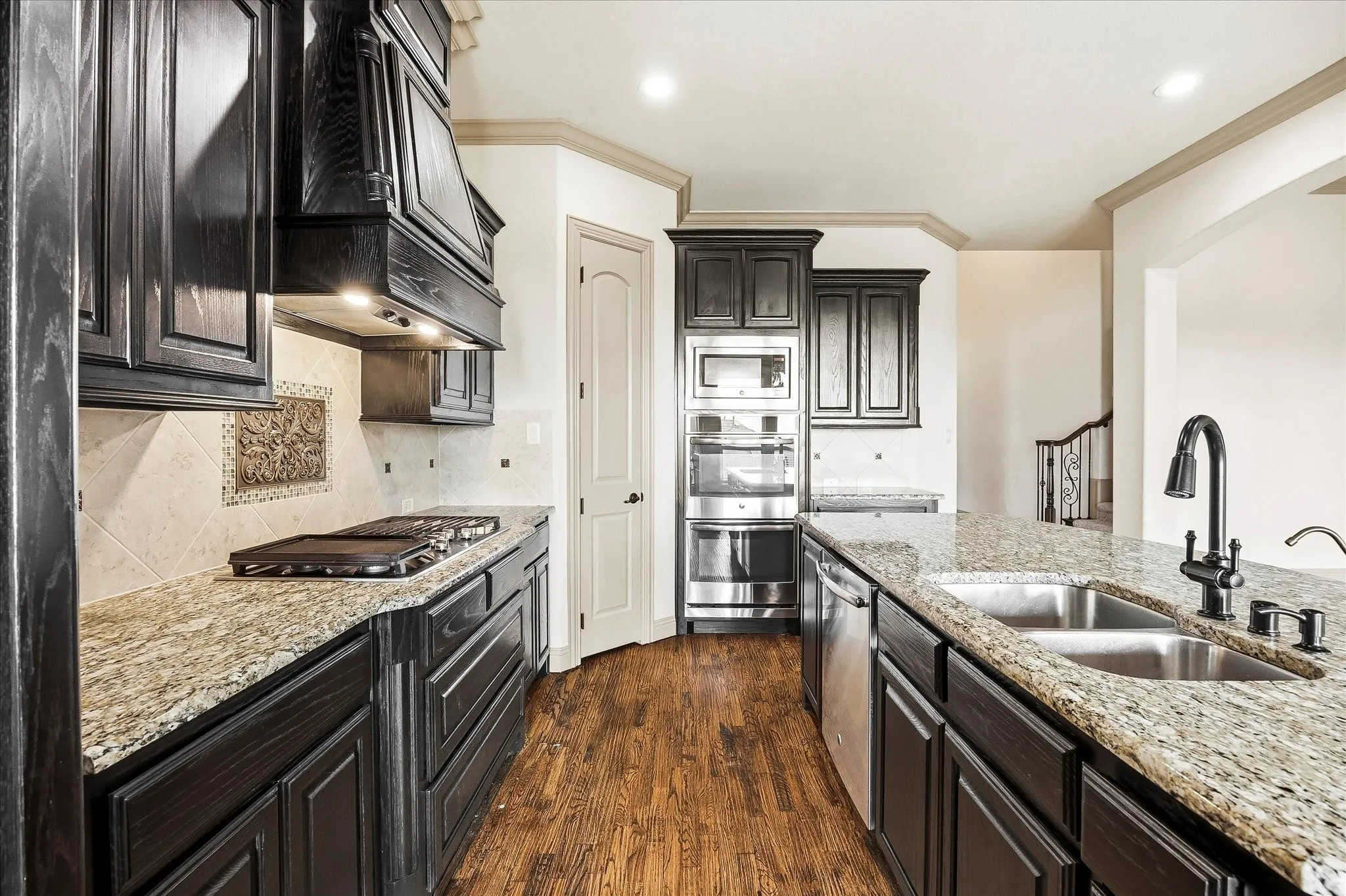 Tons of custom cabinetry provides ample storage space for your kitchen necessities!