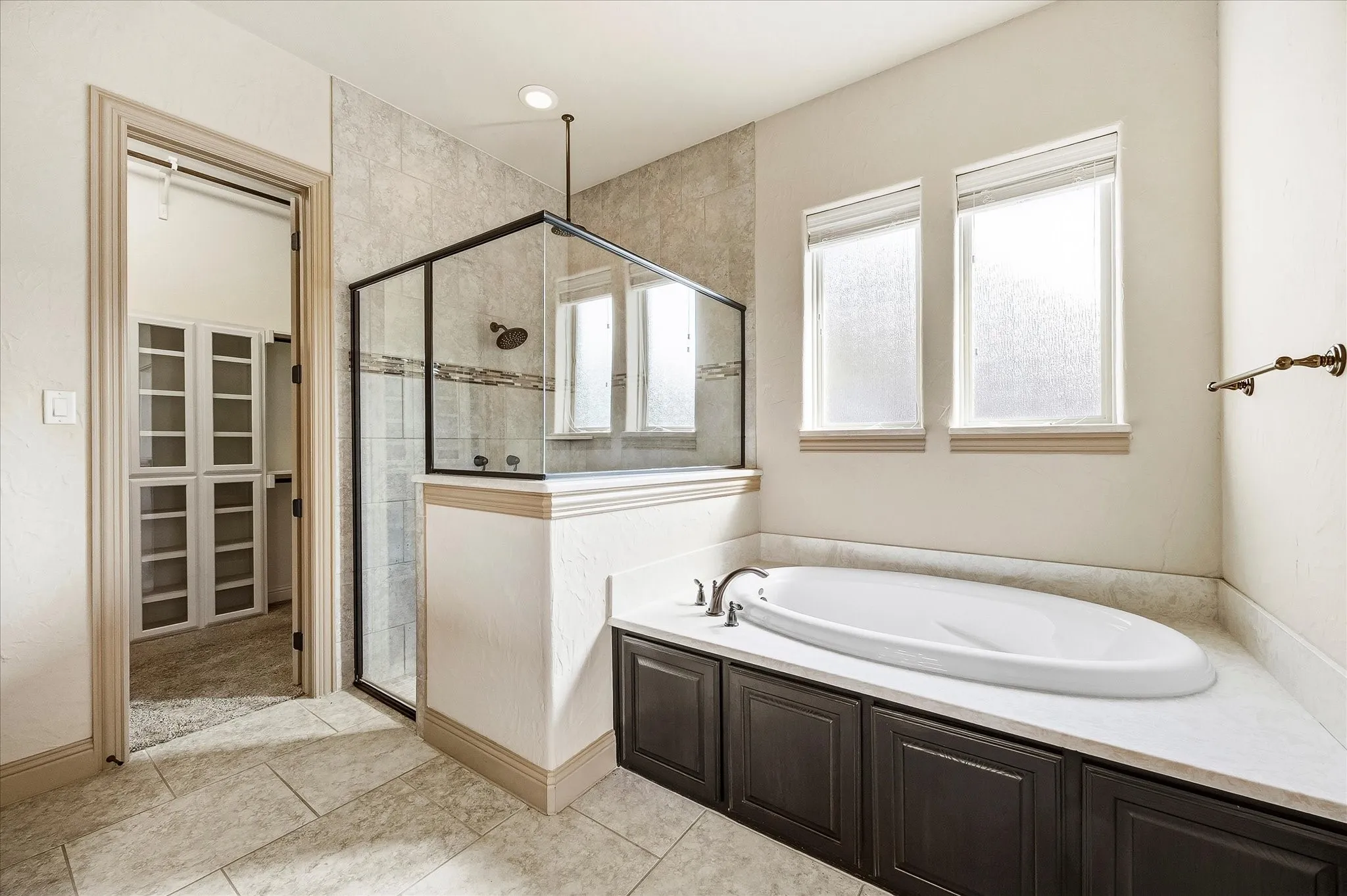 Relax here in your soaking tub and spa style rain shower