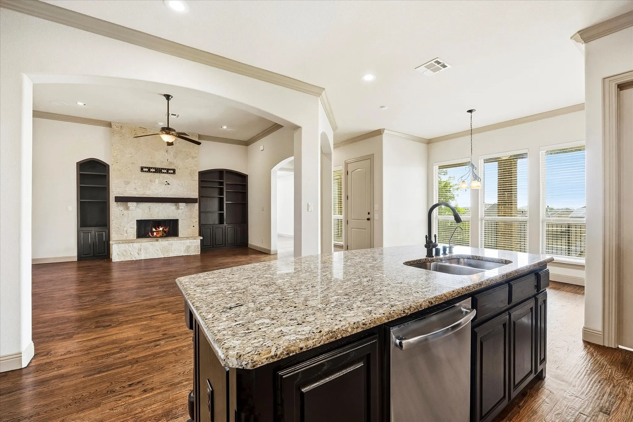 Kitchen opens onto breakfast area and living area