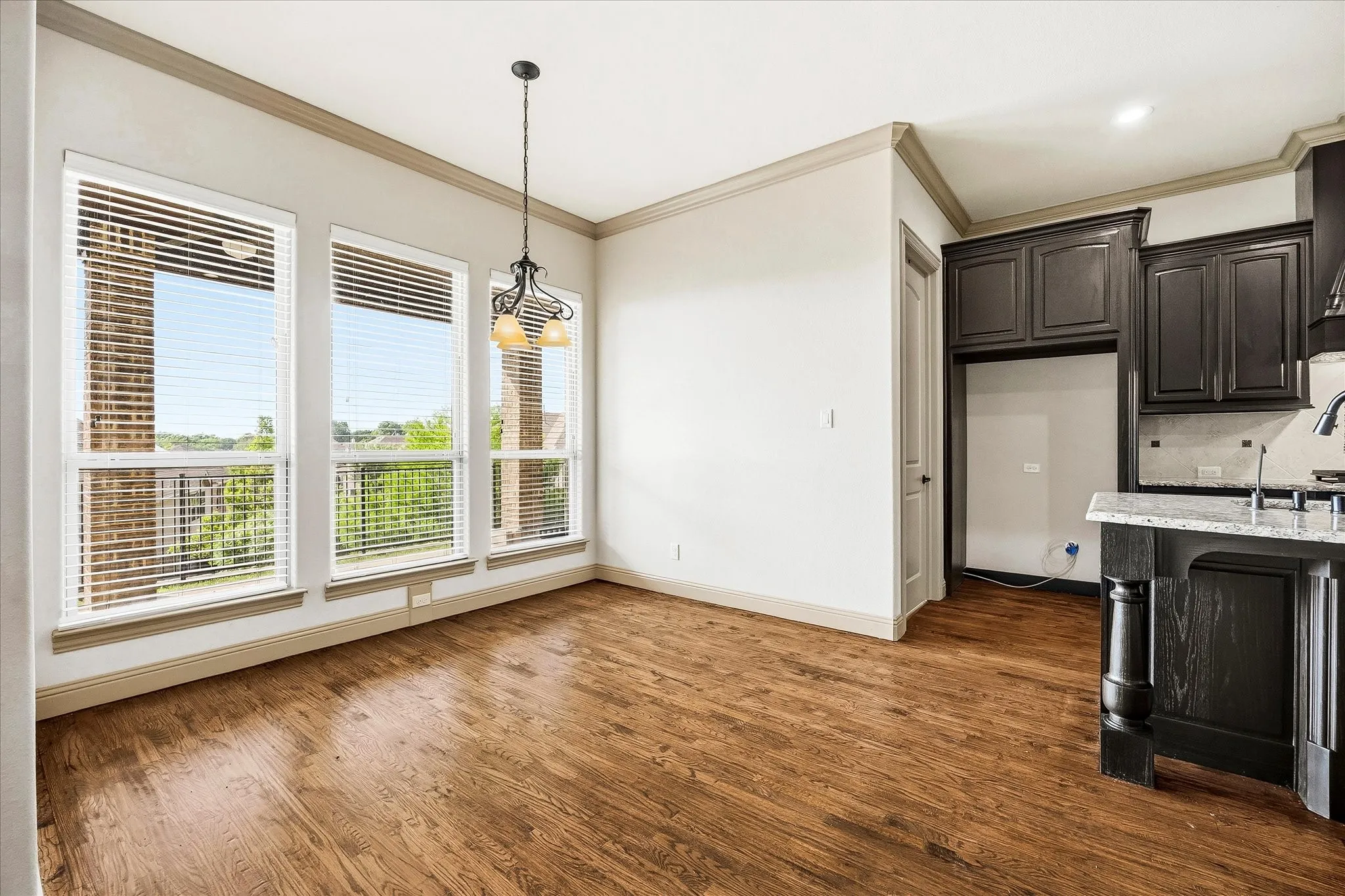 Breakfast area includes banks of windows for ample natural lighting