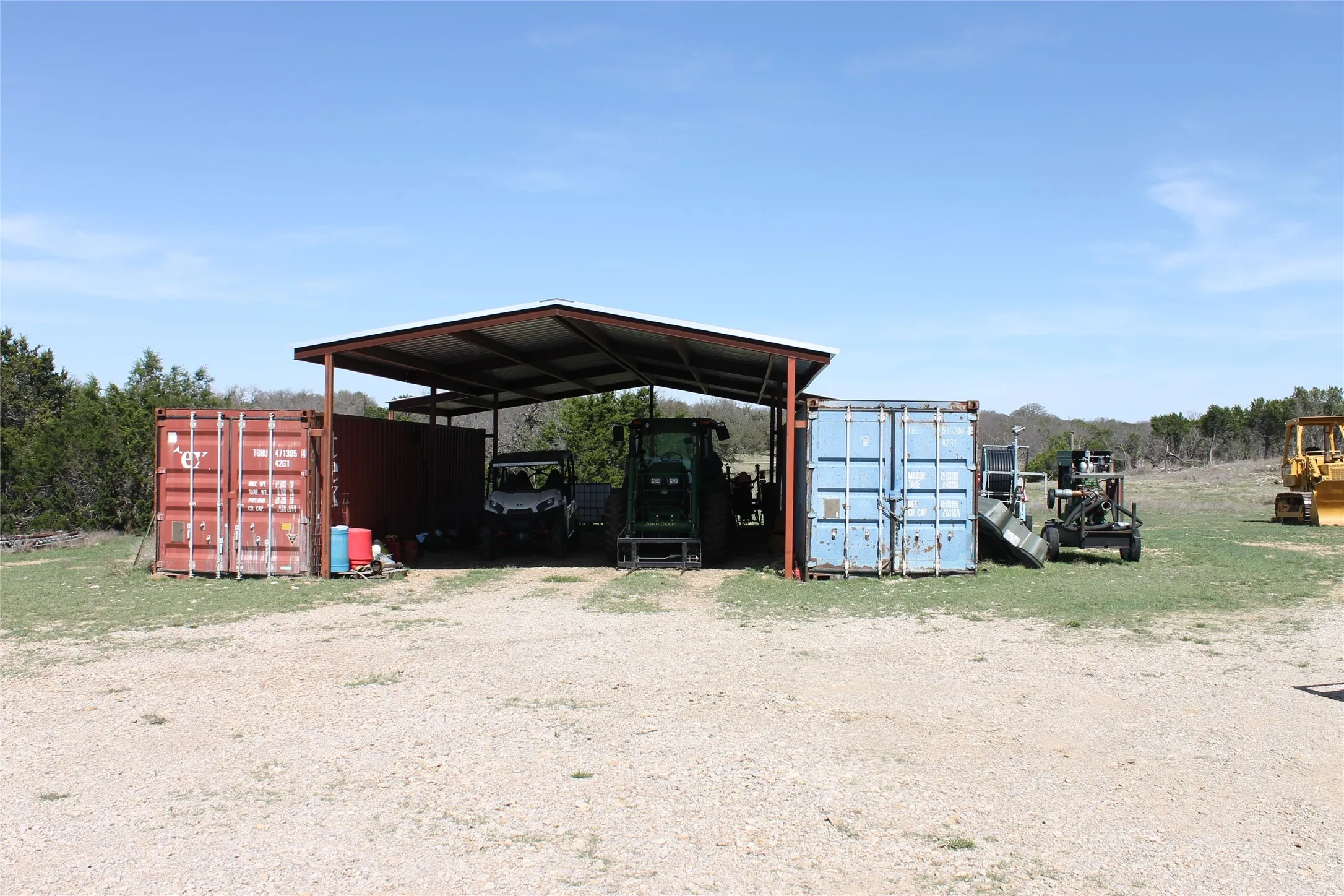 The property includes a spacious covered shed, providing ample outdoor storage and shelter