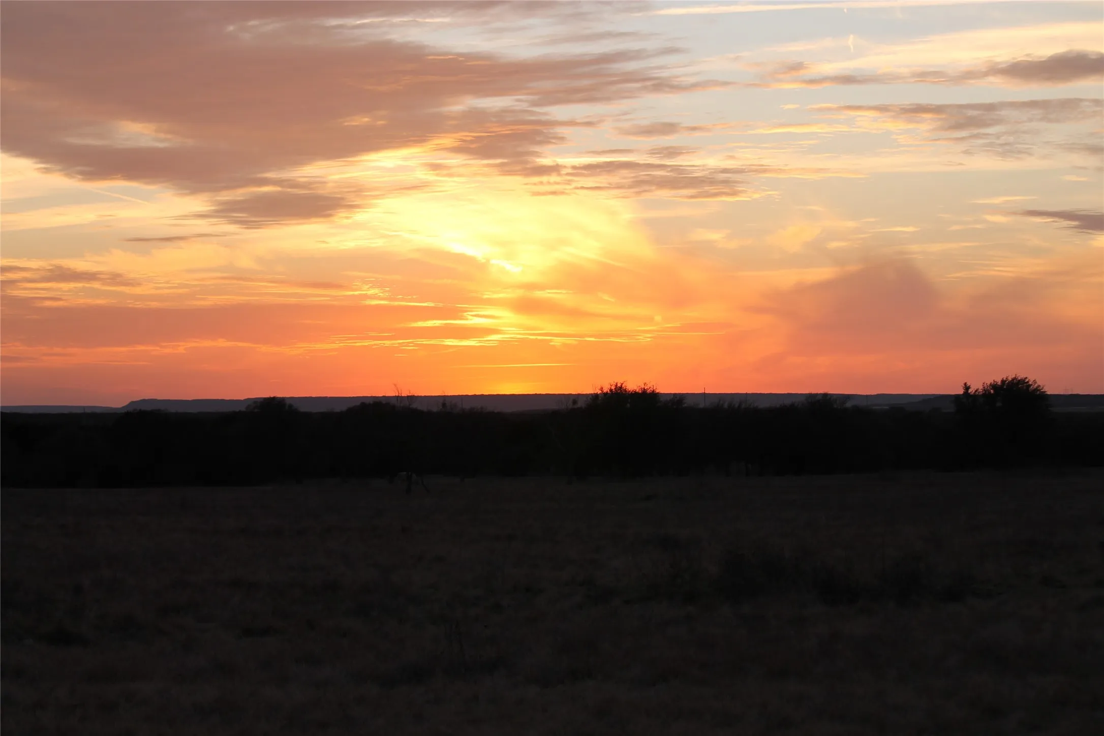 Expansive views of the horizon with vibrant sunset colors