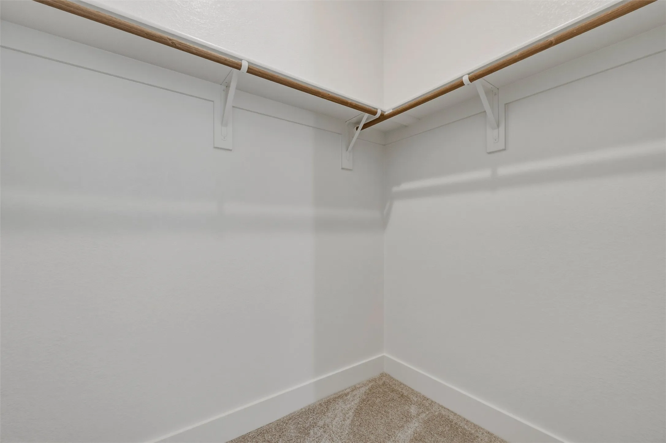 White-painted walls with light-colored carpeting