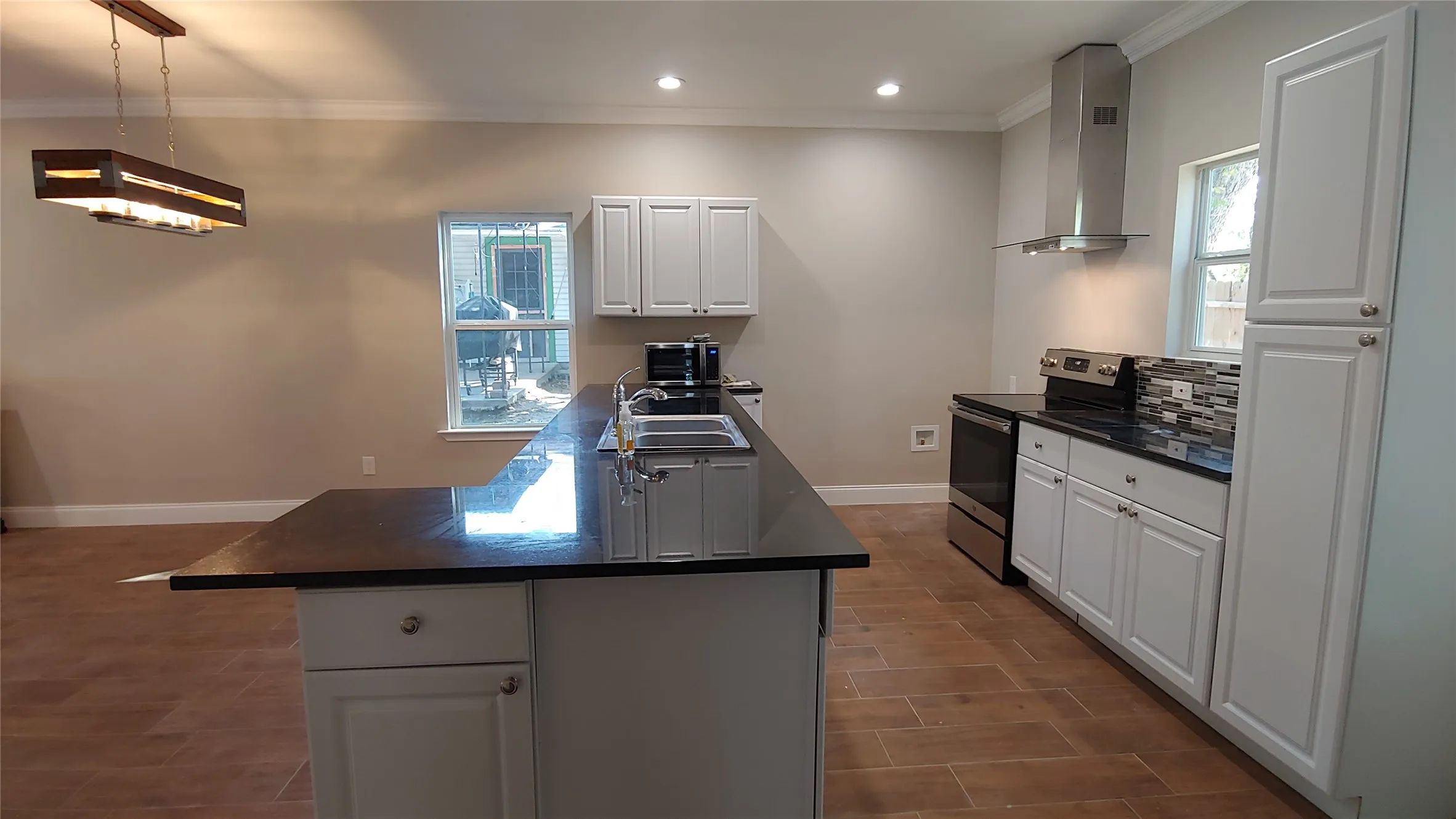 View of other side of bar. Notice the decorative lighting that will go over the kitchen table.