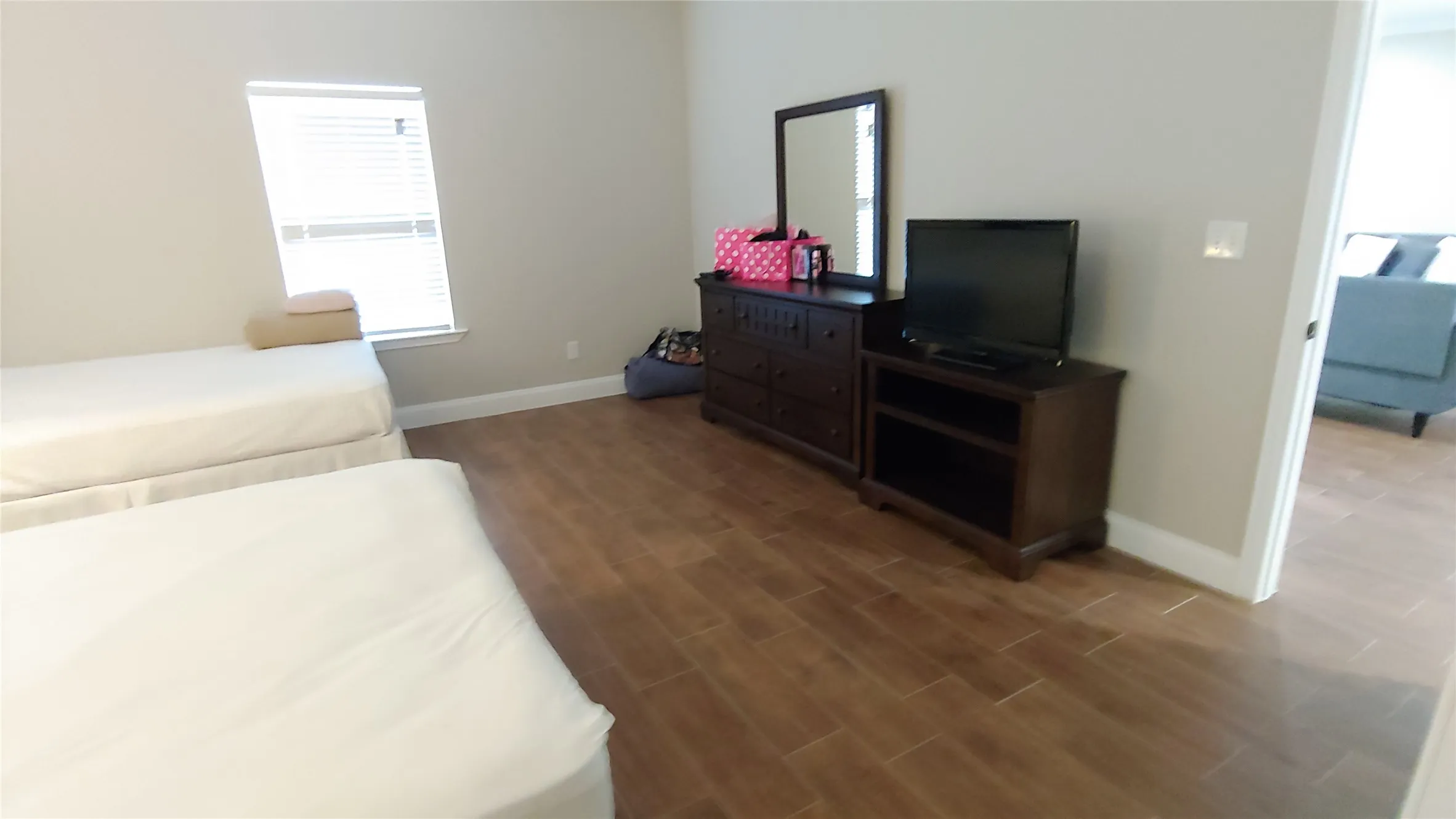 Bedroom with access to living room. Notice the window which adds good lighting.