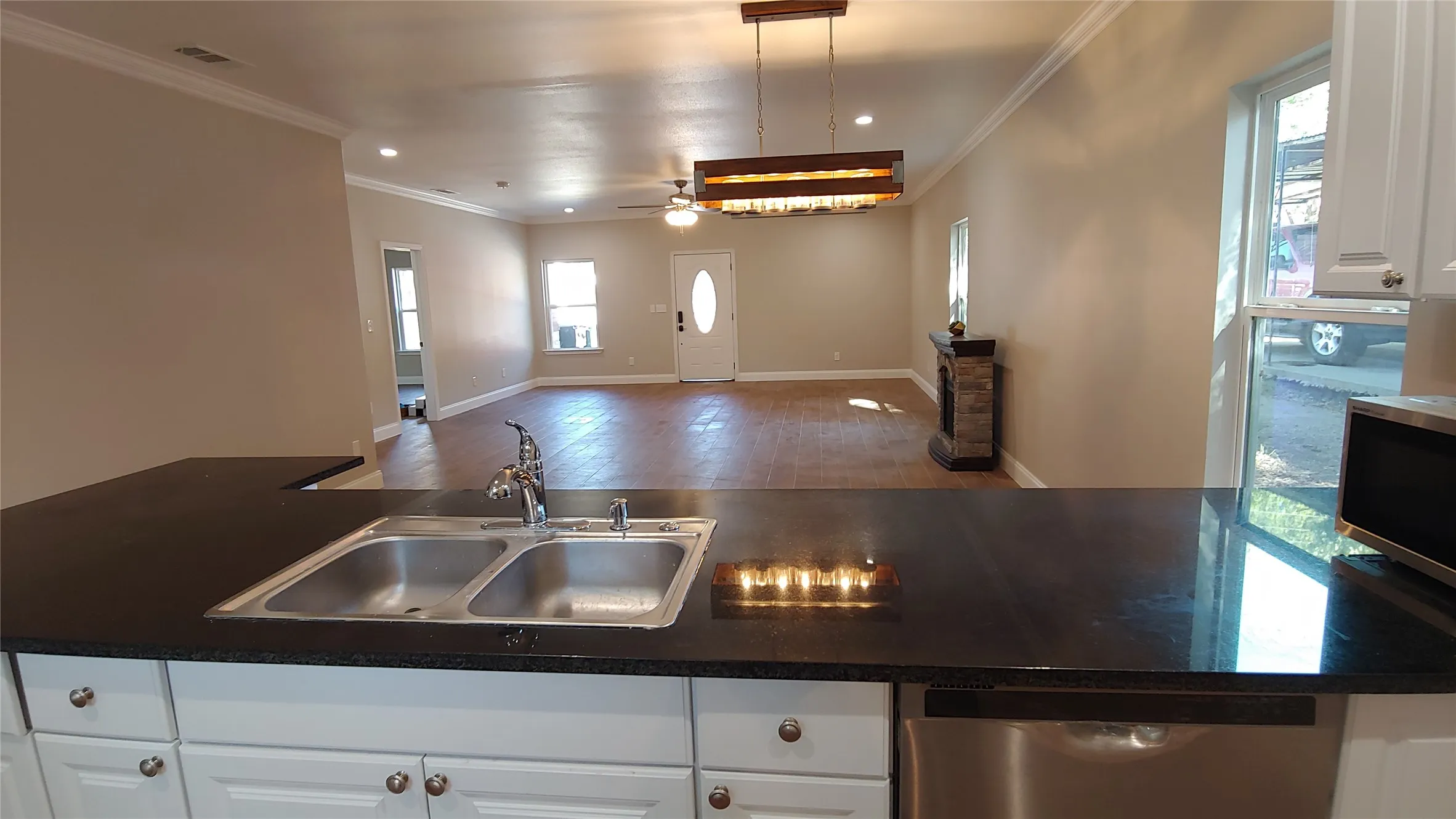 What a great view of this open space looking from the kitchen into the living area.