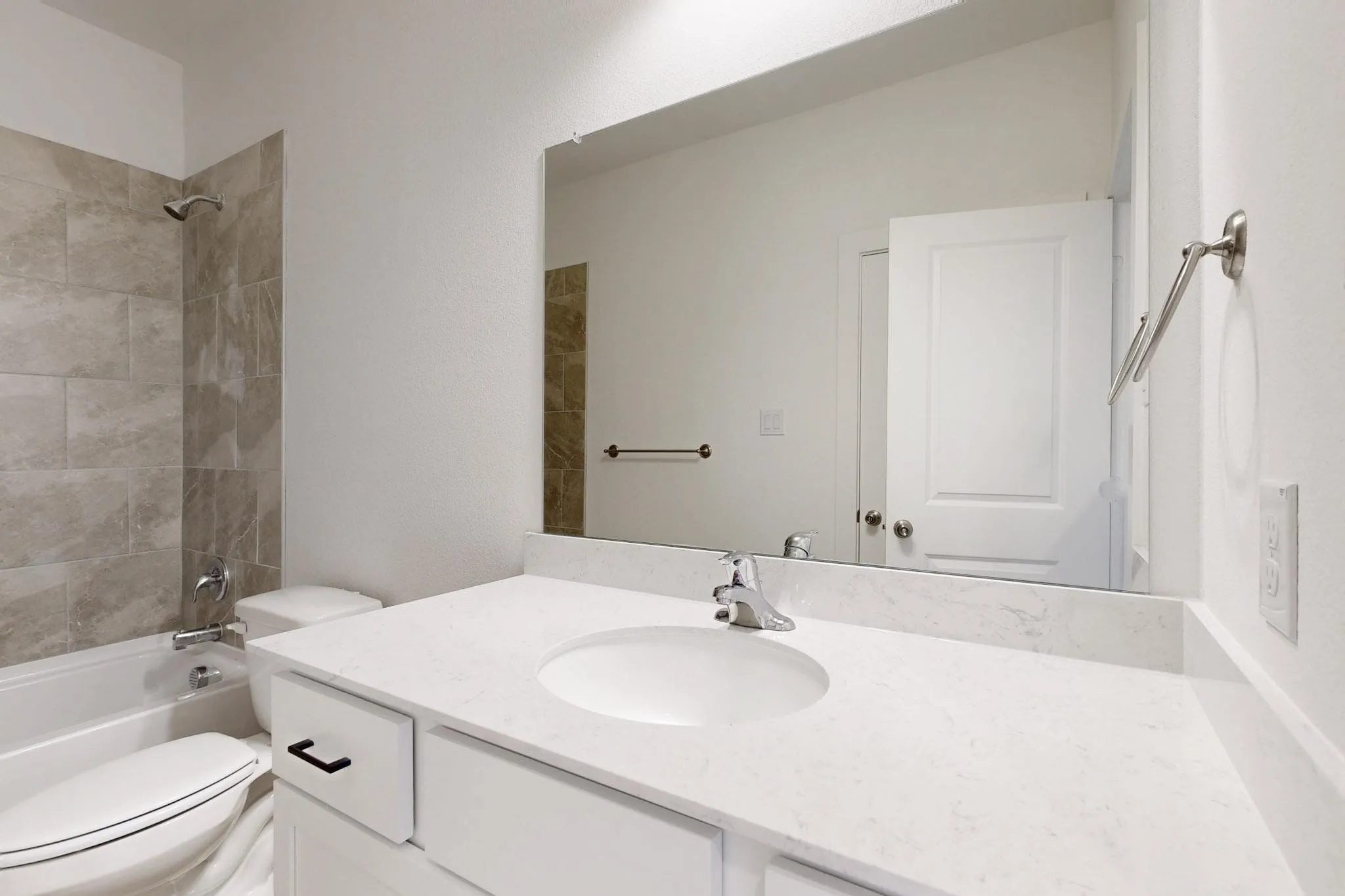 Bathroom featuring vanity and bathing tub / shower combination