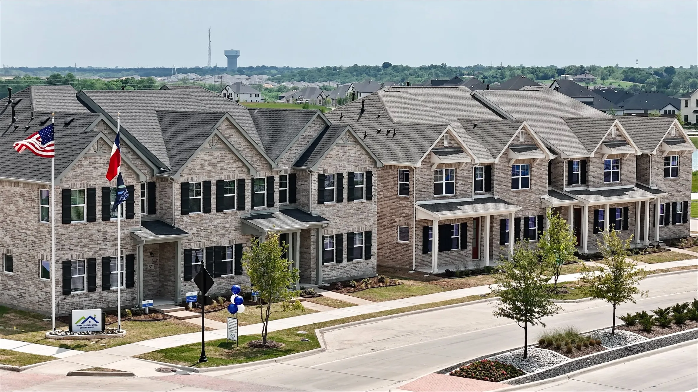 View of front of home featuring a residential view, brick siding, and a shingled roof