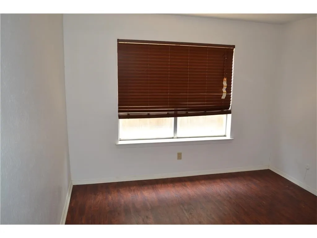 Sun-drenched room perfect for an inspiring home office or cozy reading nook.