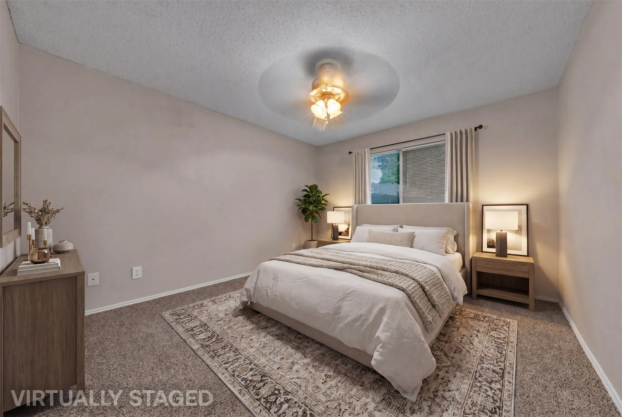 Spacious bedroom featuring neutral wall paint, carpet flooring, a ceiling fan with light fixture, and a window with blinds