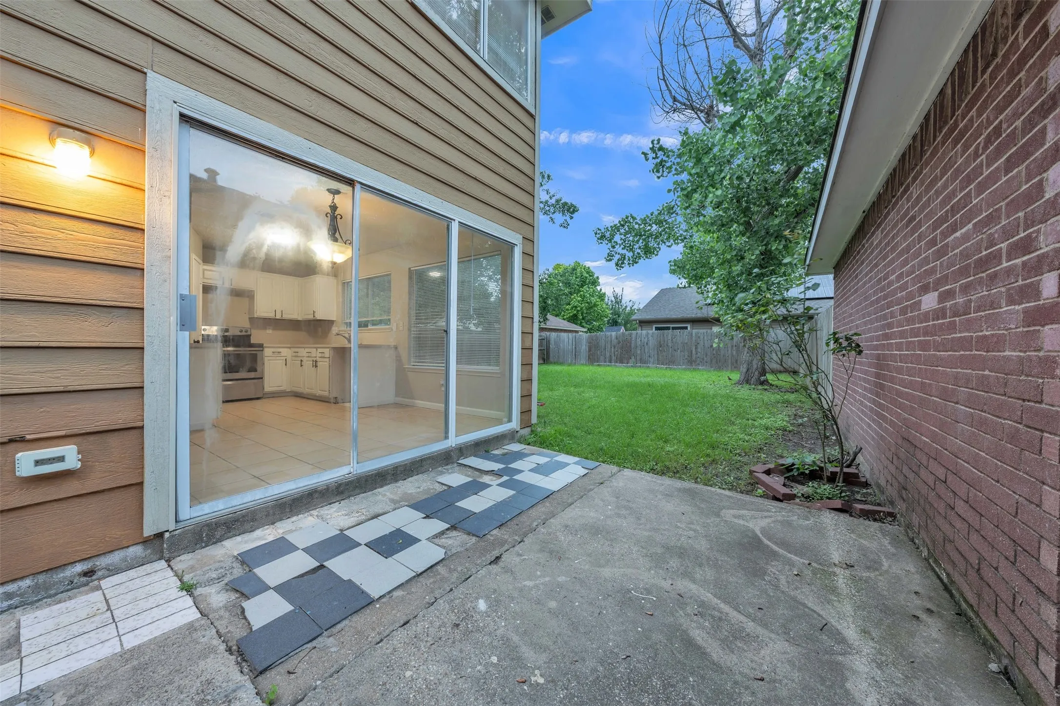 Sliding glass door opening to a concrete patio