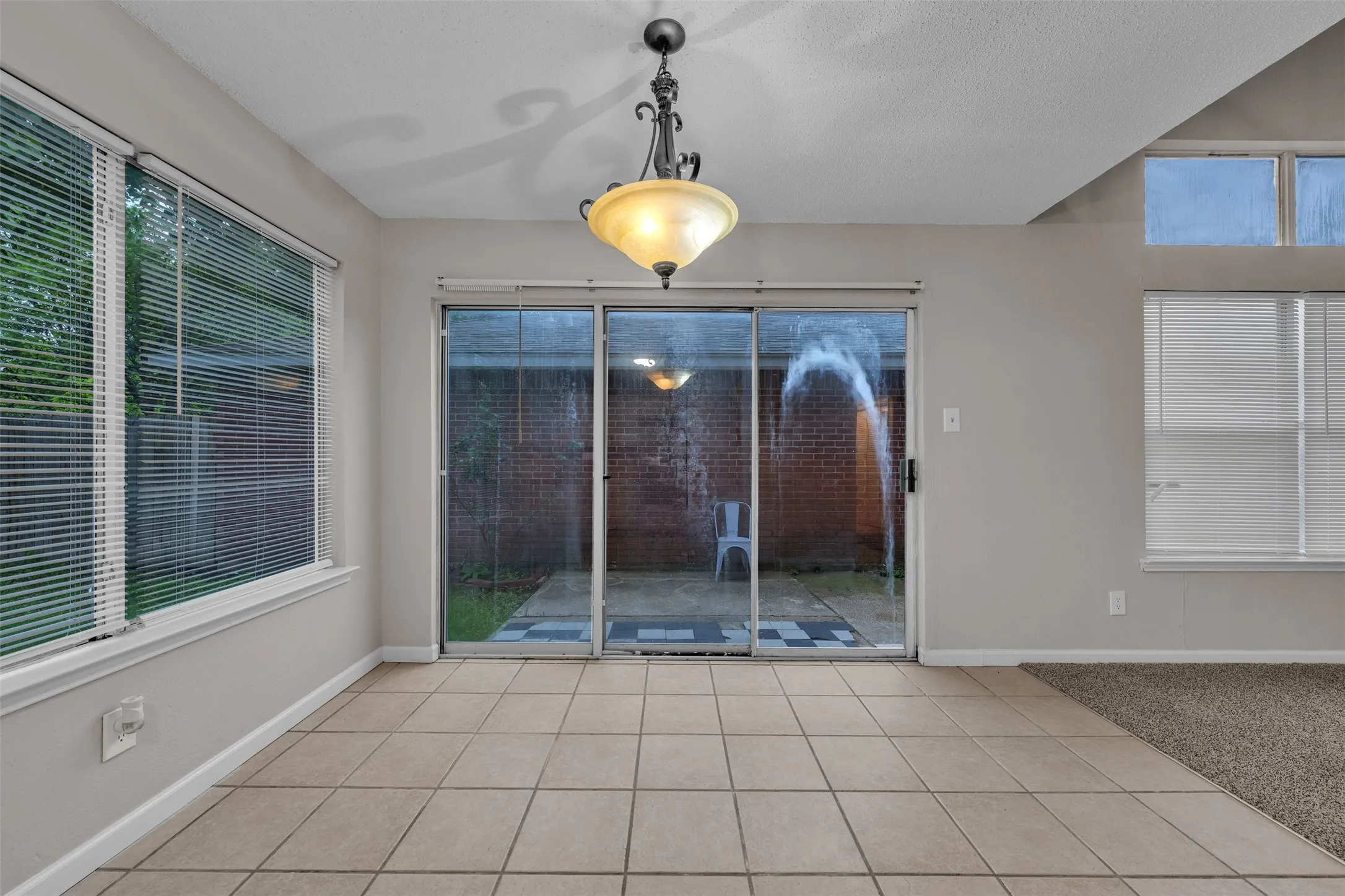 Ceramic tile flooring throughout the space