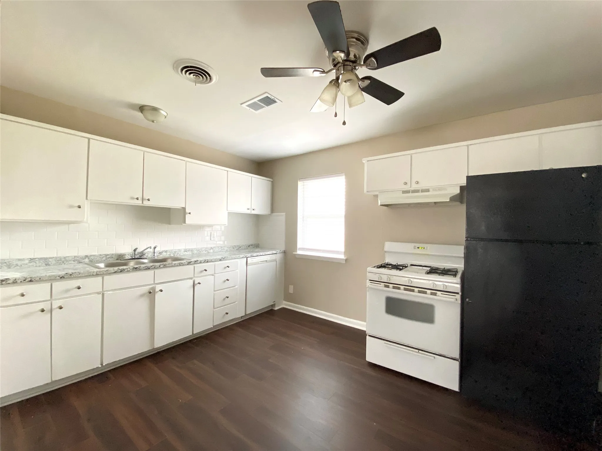 Here is your kitchen. Notice all the natural light being let in by the window.