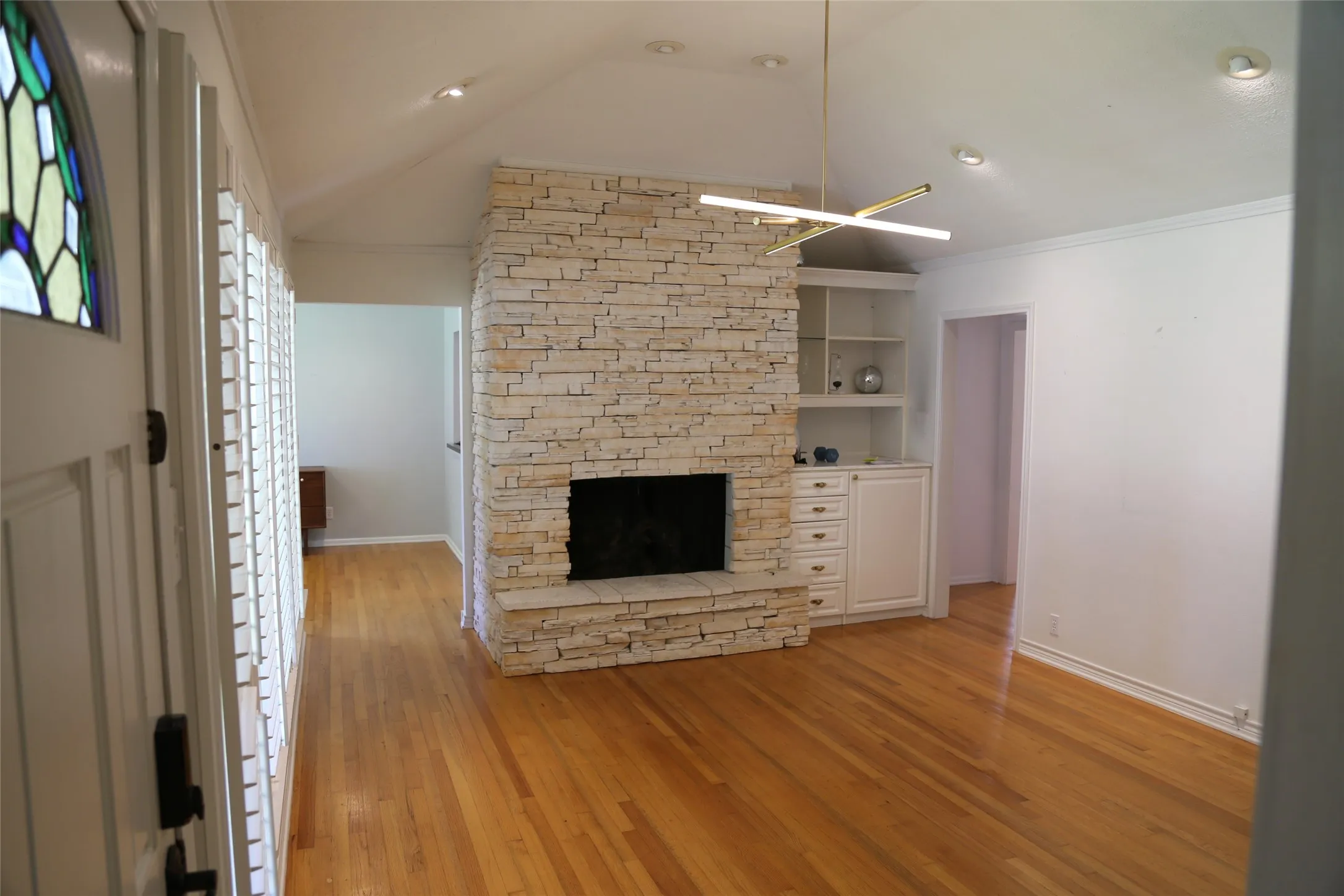 Light wood-finish flooring throughout the space