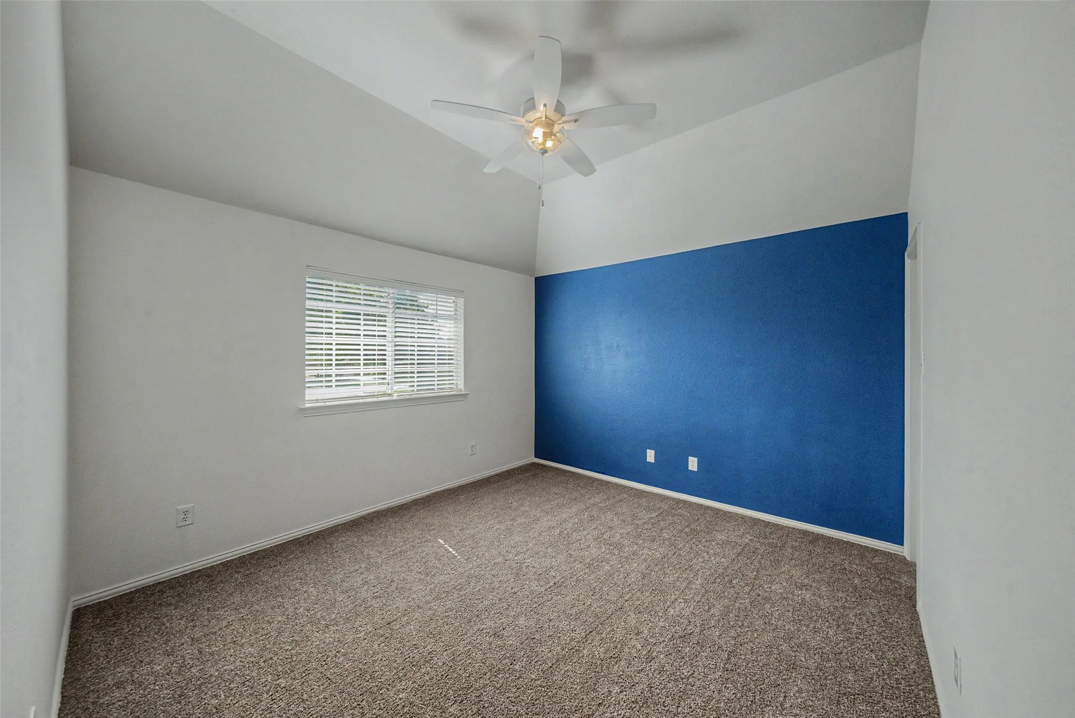 One of three upstairs bedrooms.  All new ceiling fan and carpet.