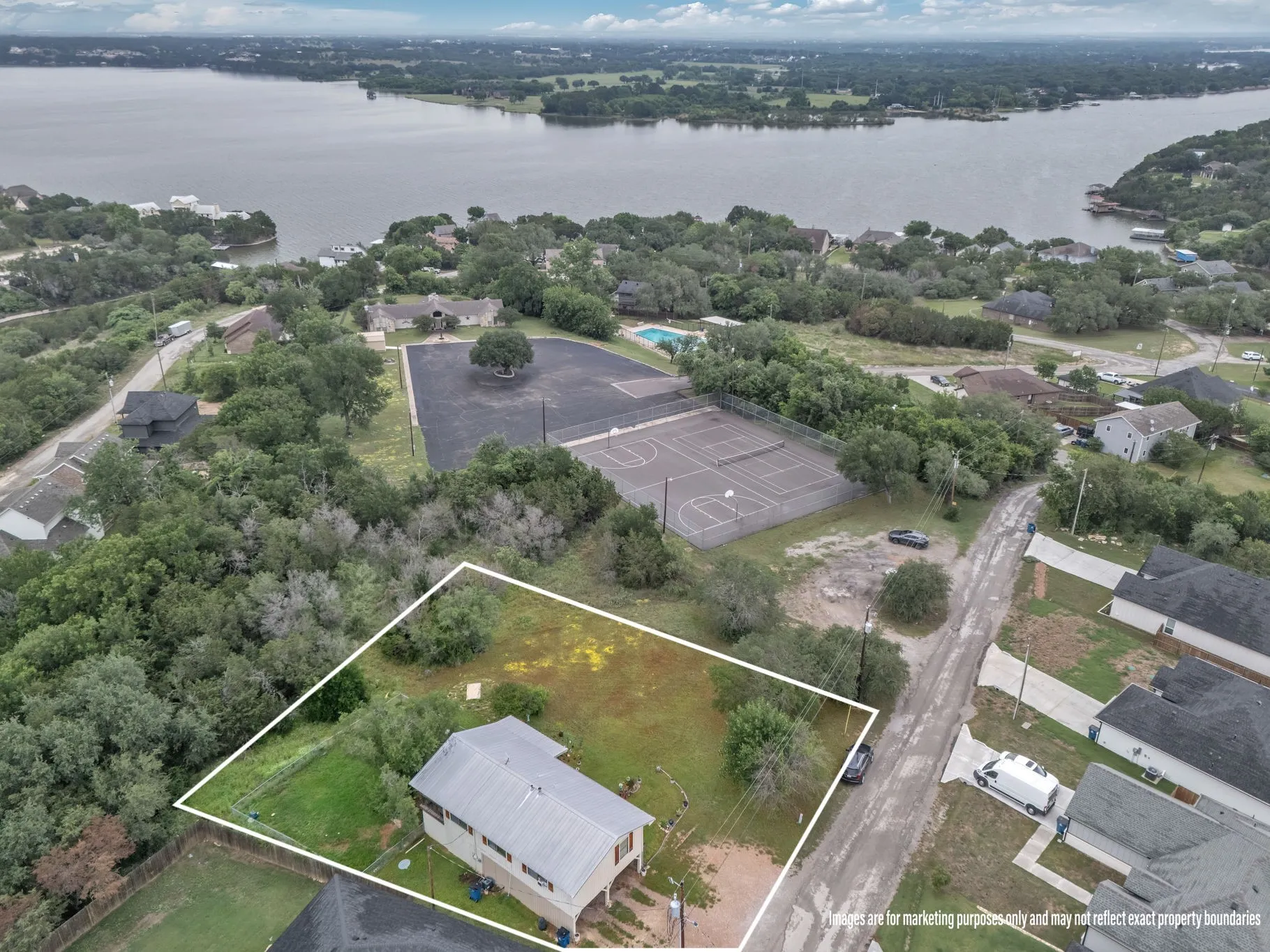 Additional aerial with property lines, emphasizing lot size and positioning within the neighborhood.