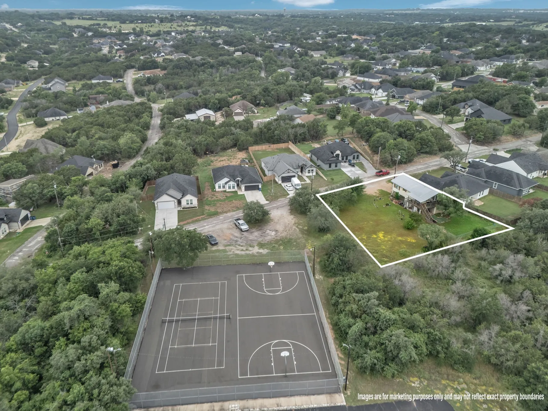Aerial with property lines outlined, clearly showing boundaries and usable land.