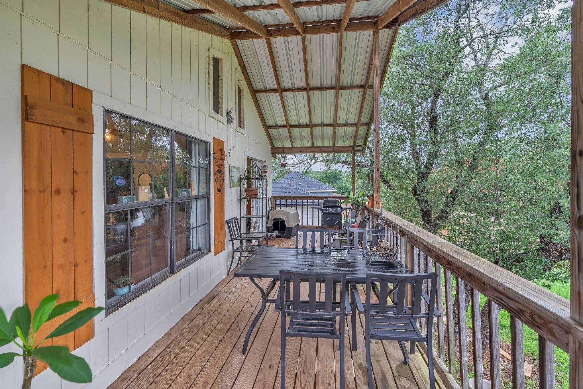 Spacious deck ideal for entertaining or quiet mornings overlooking the yard. Elevated position adds privacy and charm.