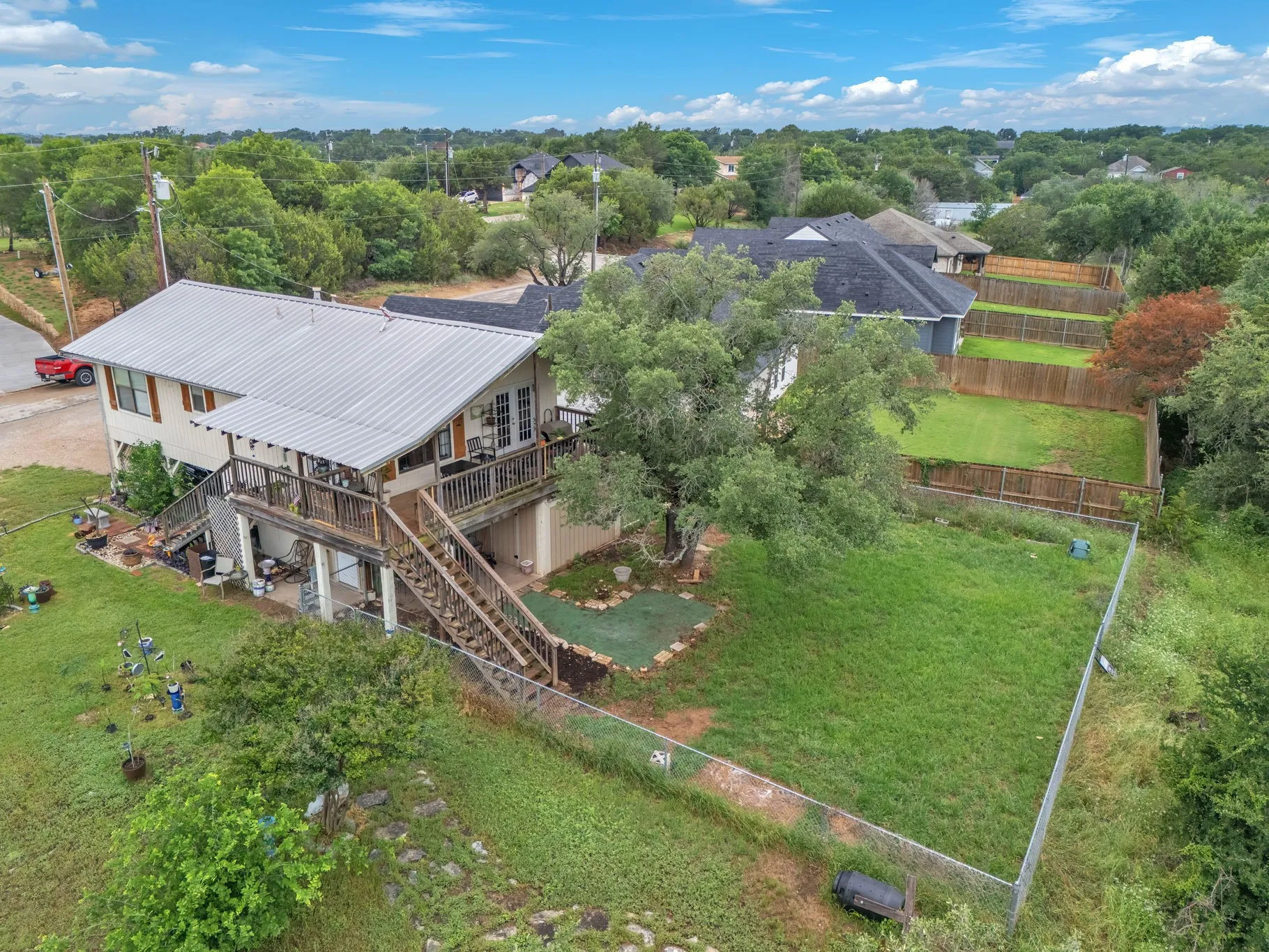 Aerial view showcasing the home’s position on the lot and overall layout. Highlights space and surrounding area.