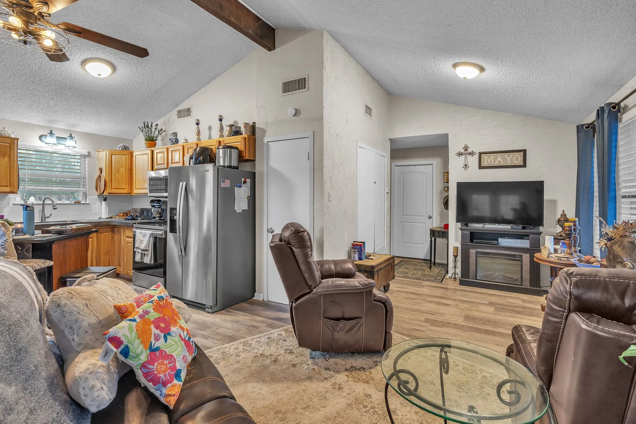 Open-concept view connecting the living area to the kitchen. Ideal layout for entertaining.

