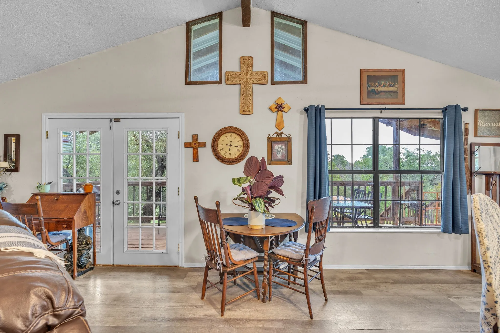 Dining area filled with natural light and easy access to the outdoor deck. Perfect for meals with a view.