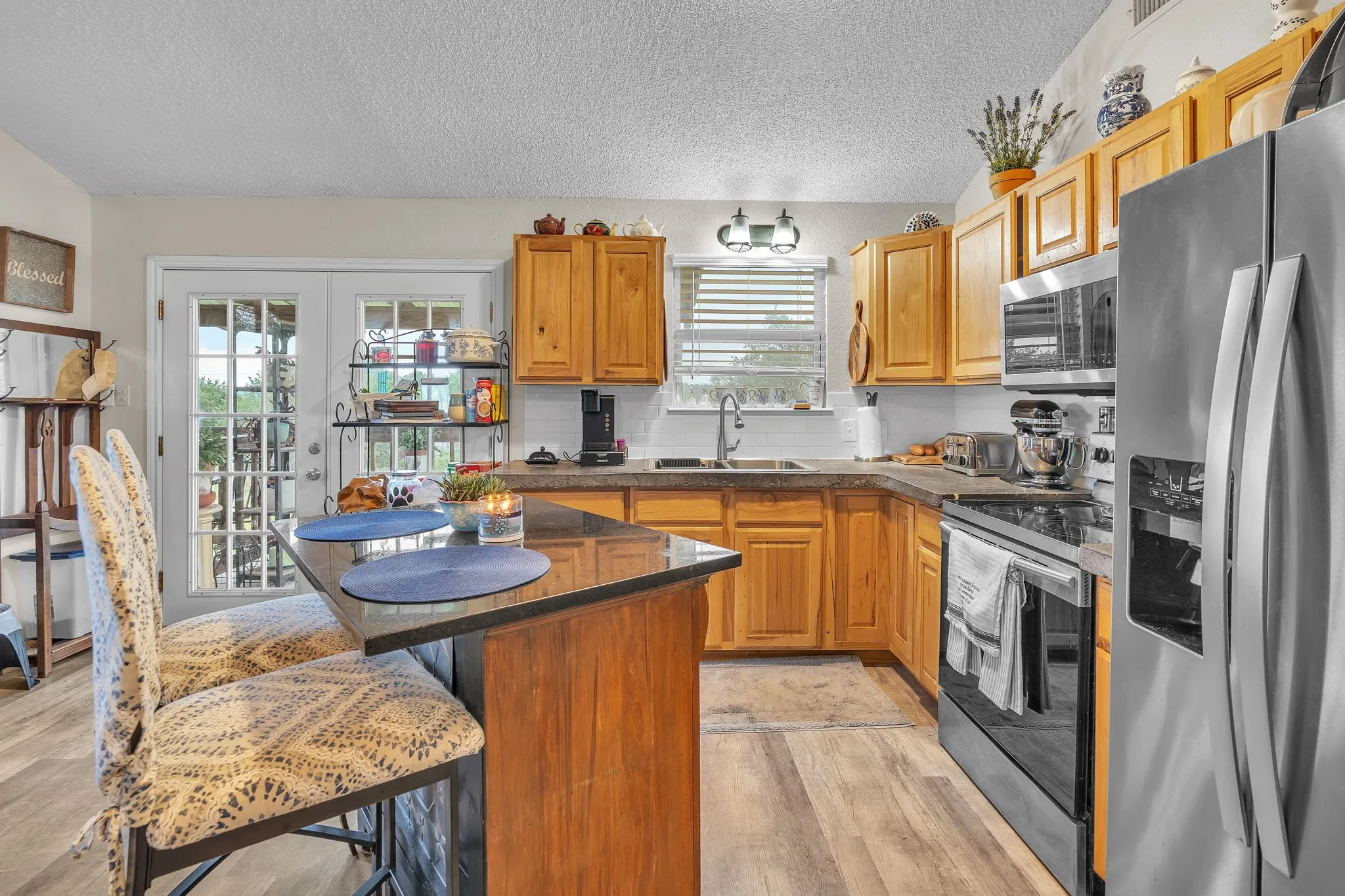 Kitchen with ample cabinetry, prep space, and an efficient layout. Designed for both functionality and flow.