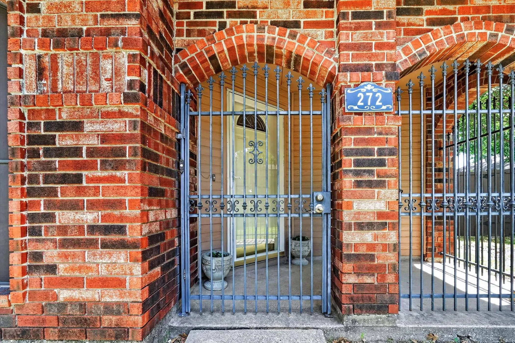 Brick facade with varied coloration and arched details