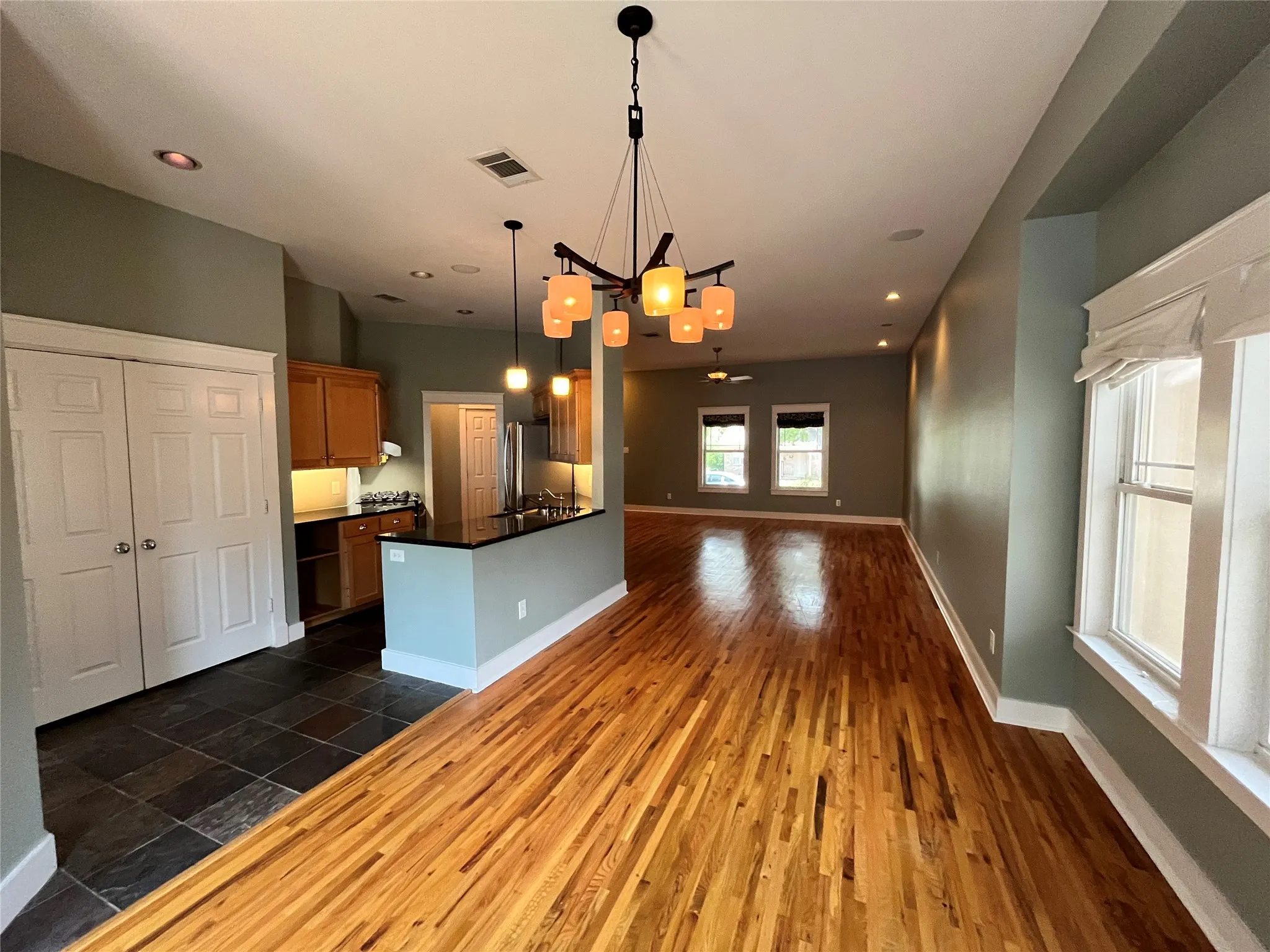 Wide view of the kitchen and dining space showing the open floor plan.