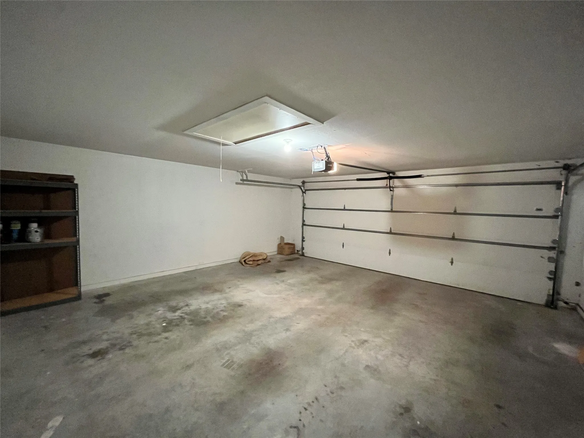 Large, clean two-car garage with plenty of workspace.