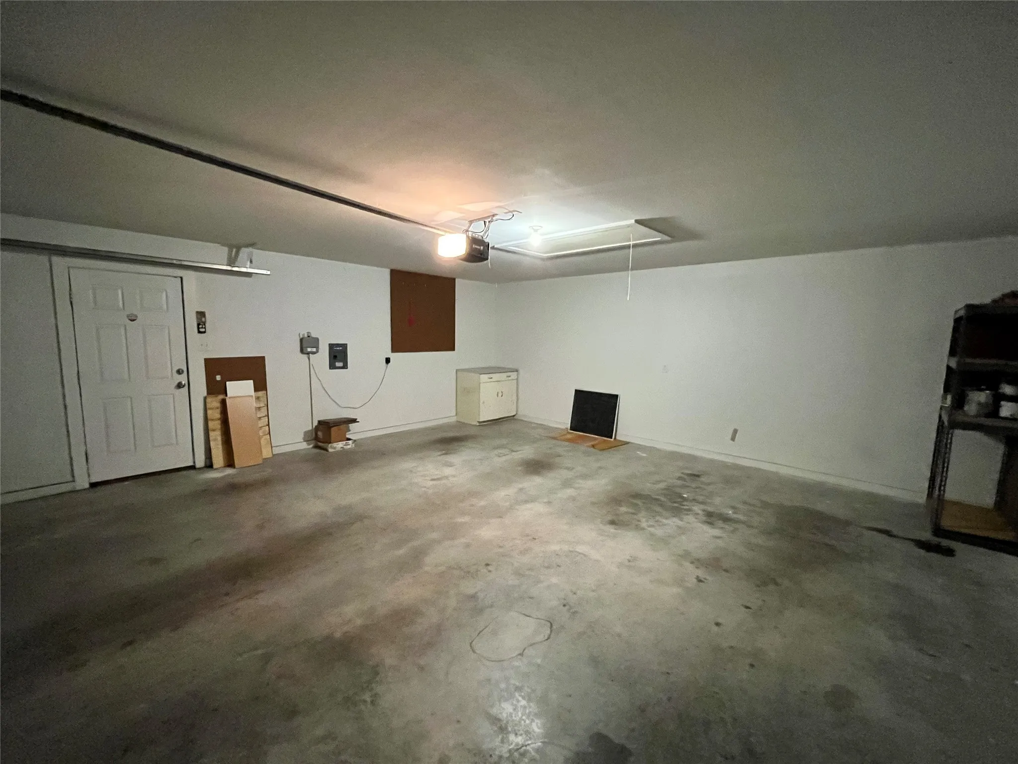 Another view of the garage showing the spacious interior.