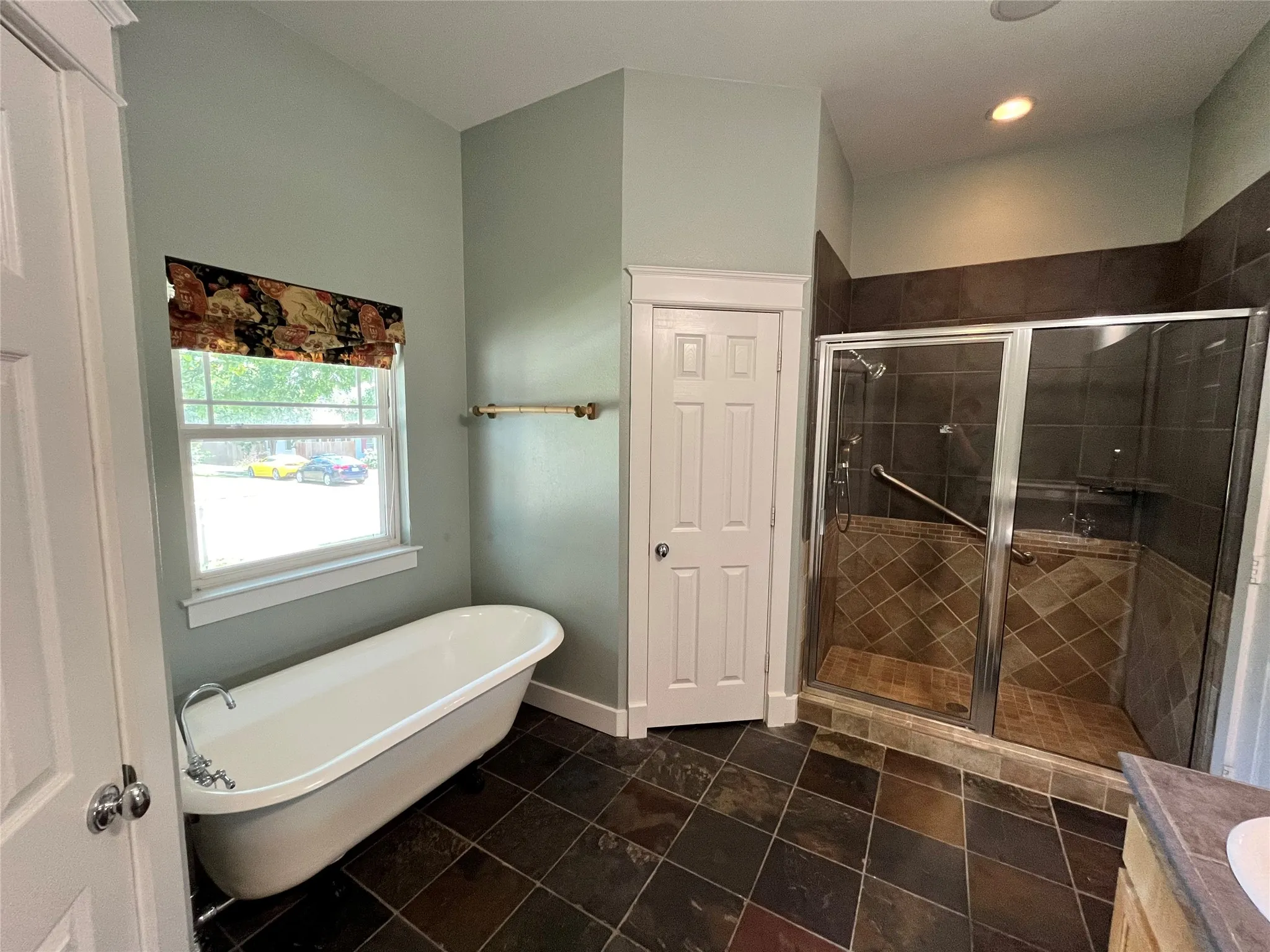 Bright bathroom with updated vanity and tile flooring