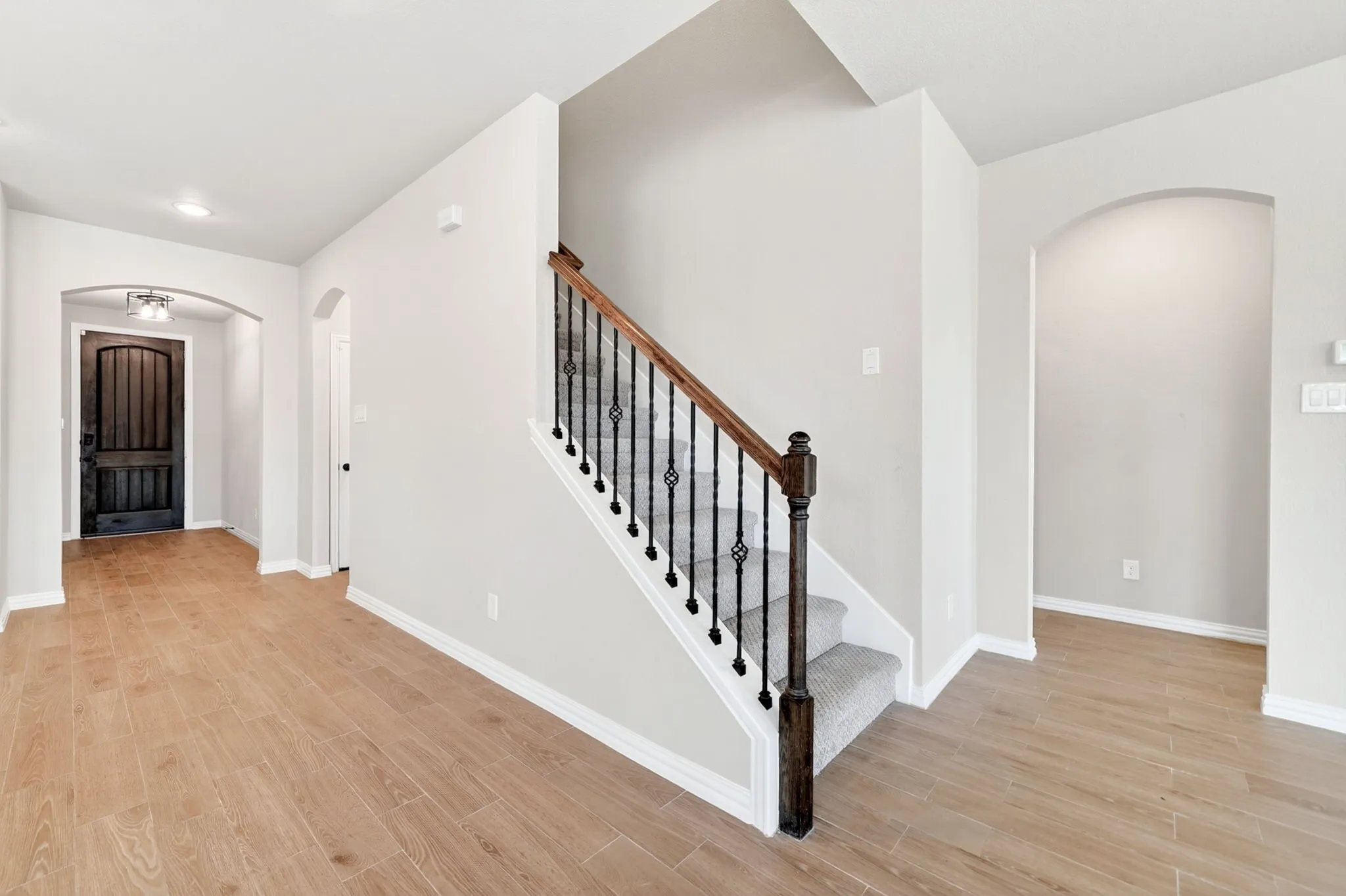 Doorway Leading to Primary Suite off of Main Living Area Downstairs