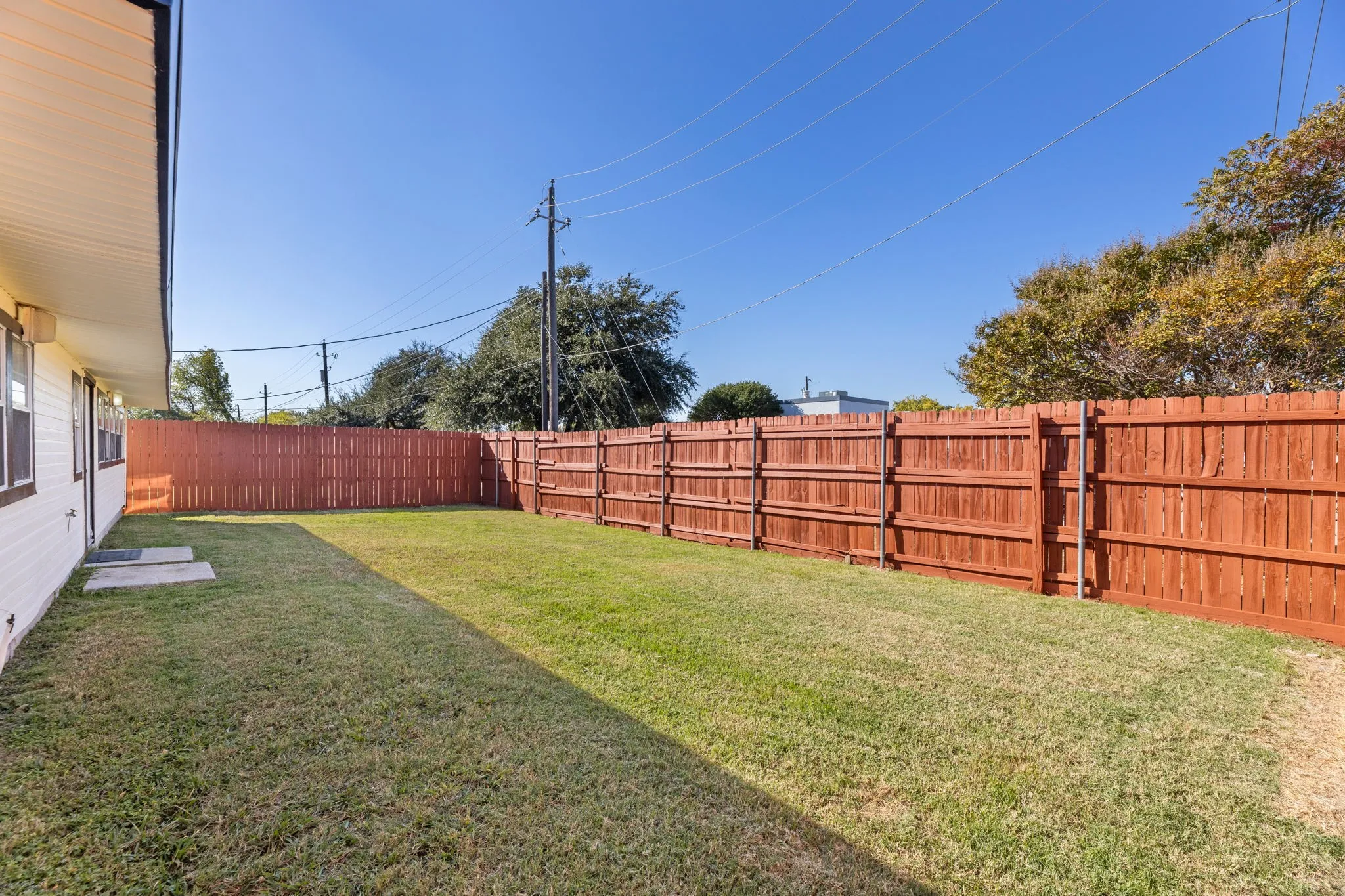 View of fenced backyard