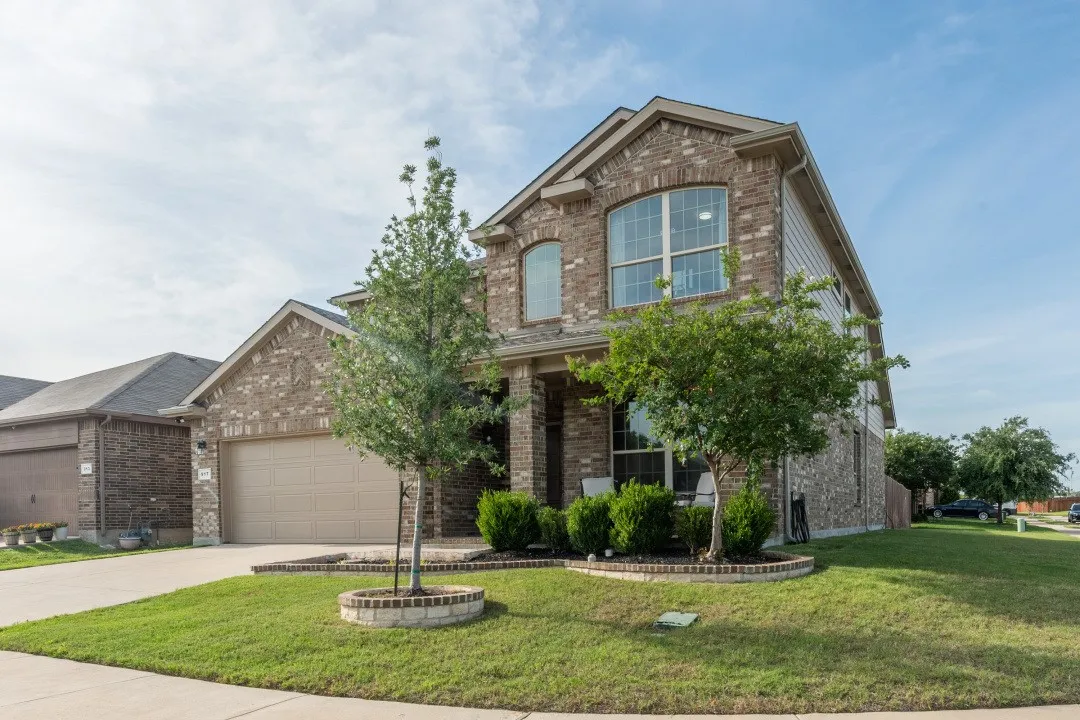 Two-story corner lot brick facade residence