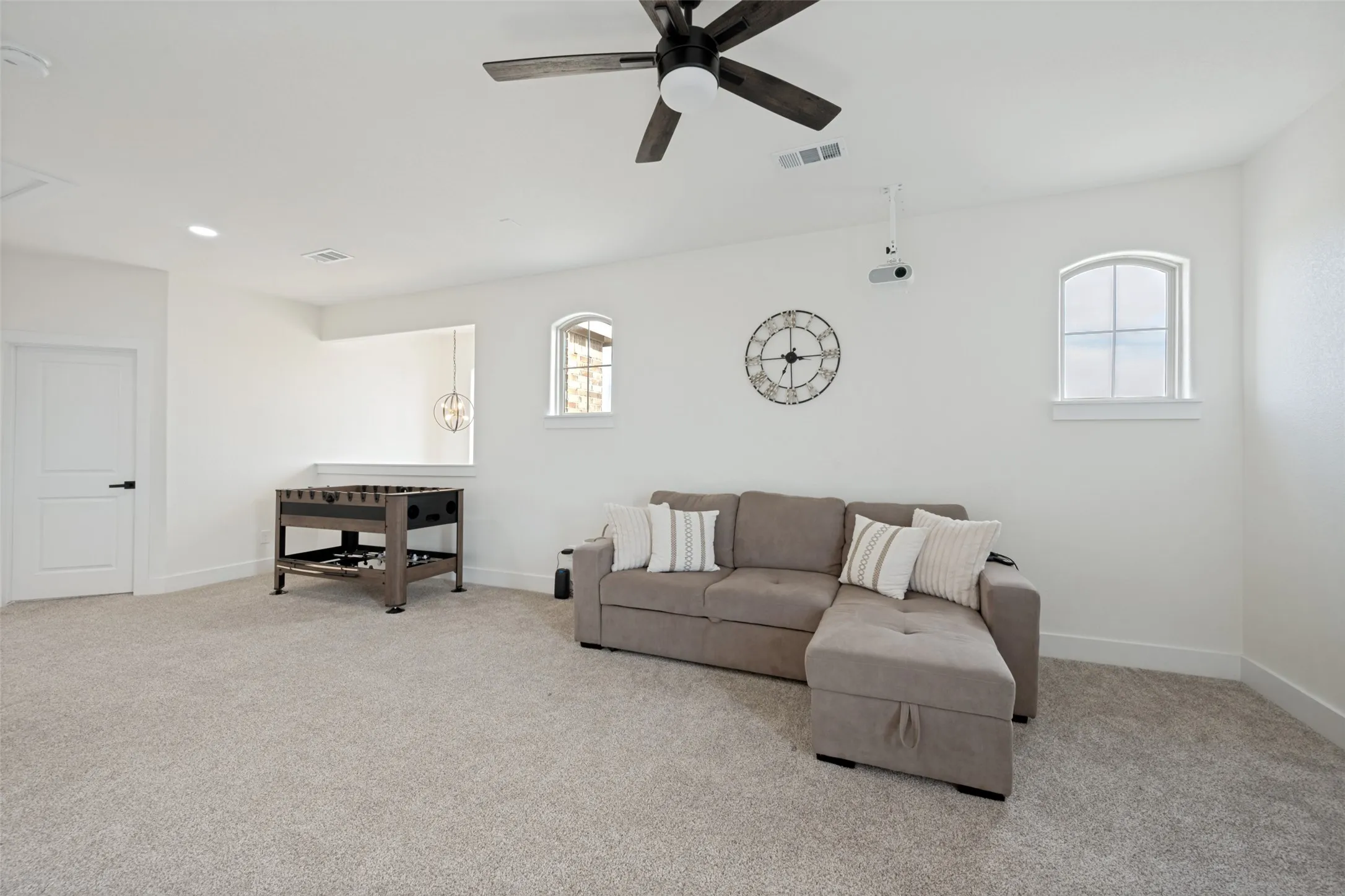 Spacious interior with neutral carpeting