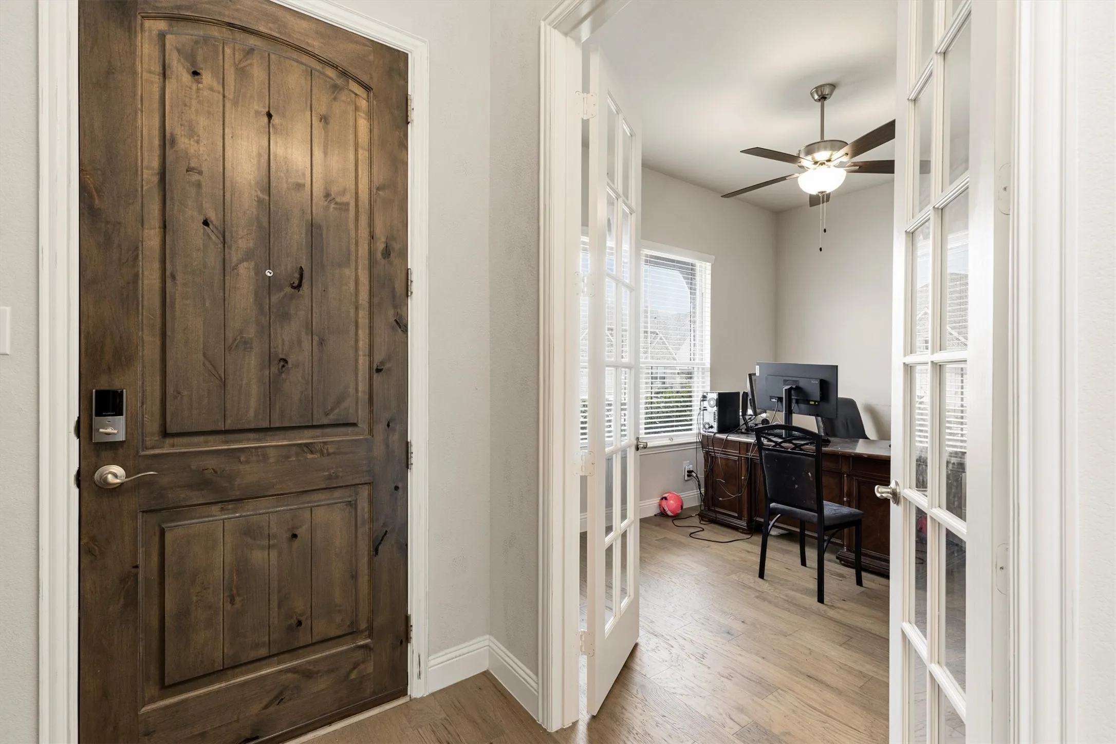 Rich wood-finish front door with smart lock hardware